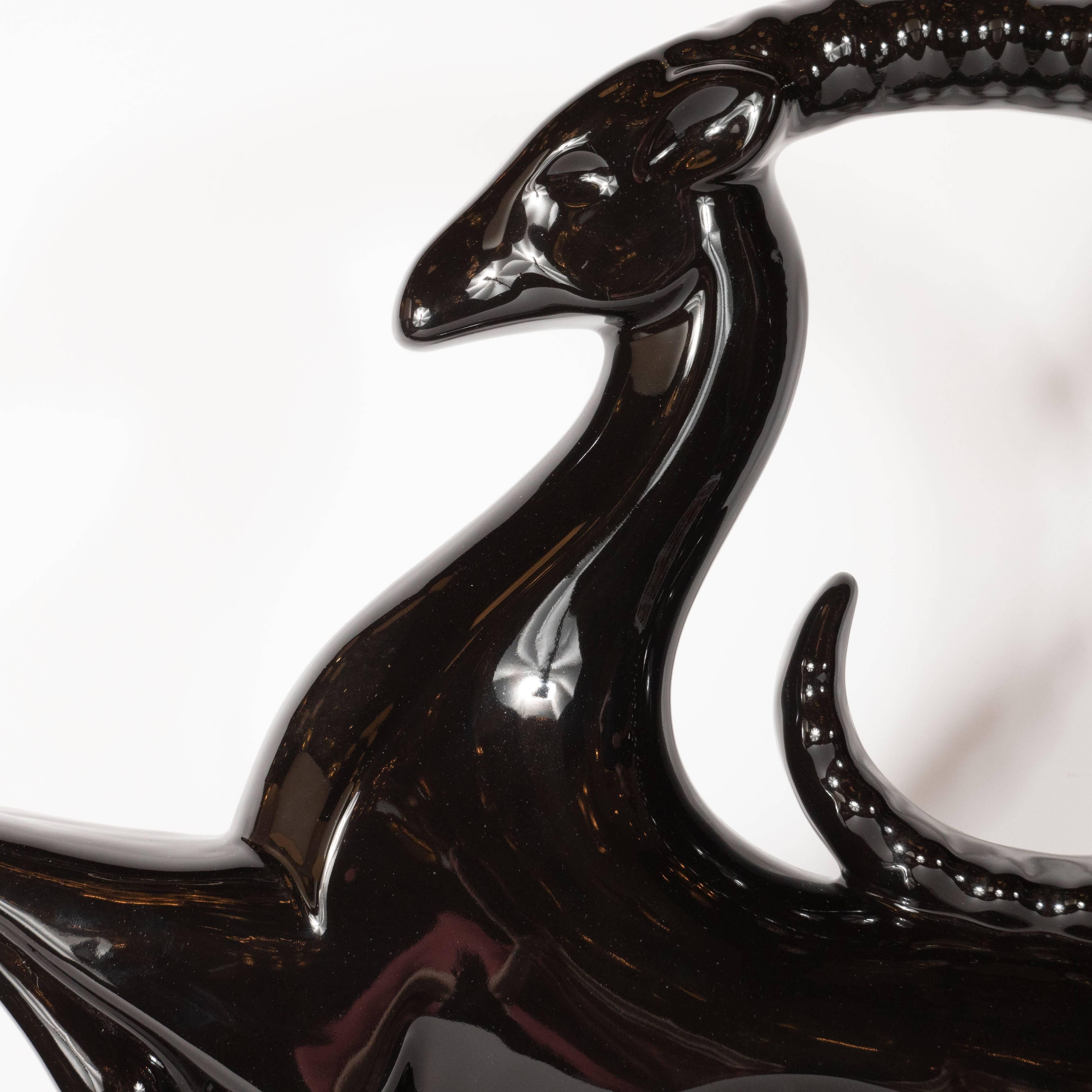 American Pair of Art Deco Style Lustrous Black Ceramic Glazed Leaping Ibis Sculptures