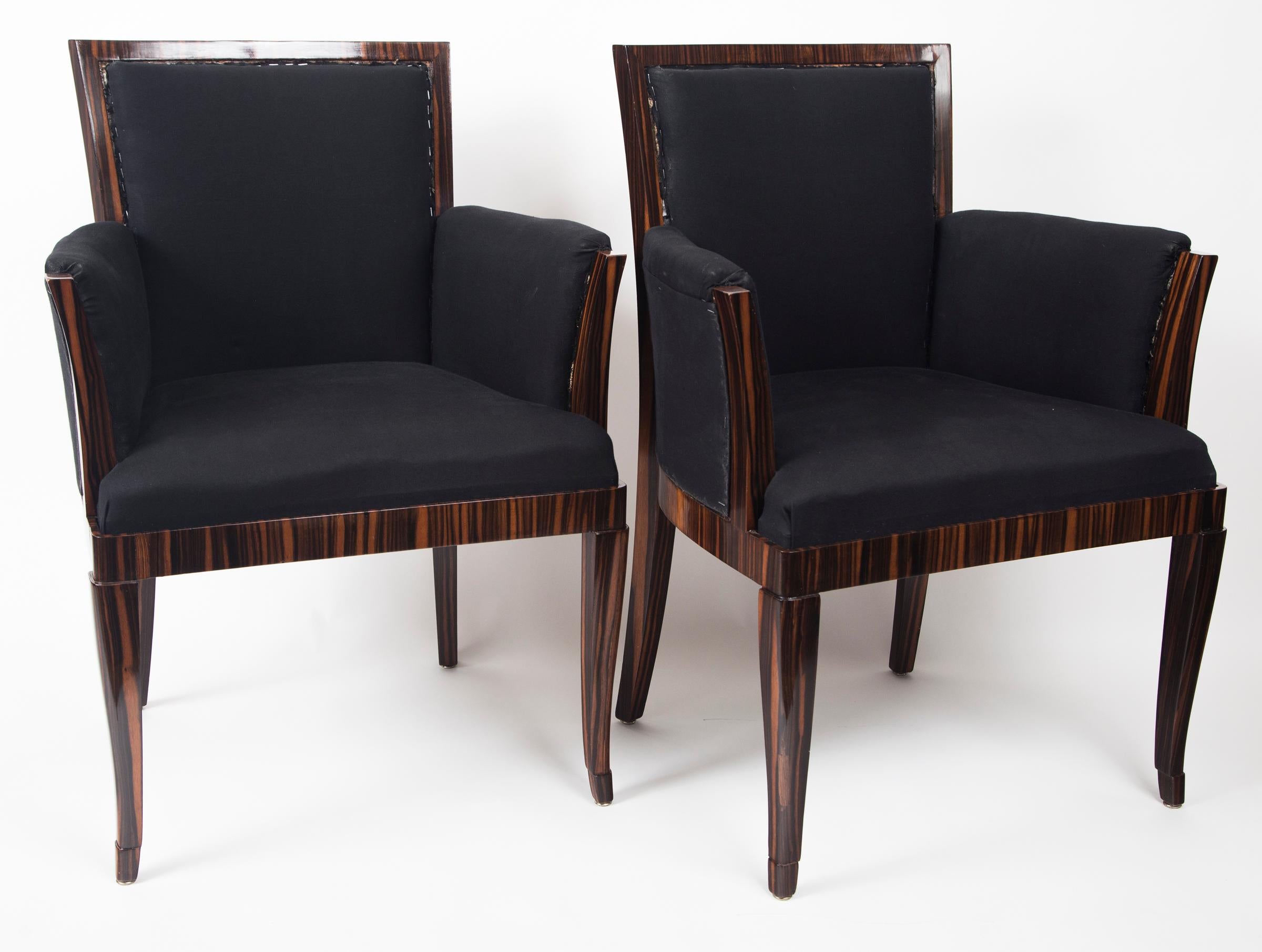 Sharp pair of upright upholstered Art Deco style Armchairs in Makassar ebony upholstered in a dark blue muslin- fabric ready.
Note, very comfortable upright chairs ideal for a desk setting or game playing or for smaller scale area
Origin: