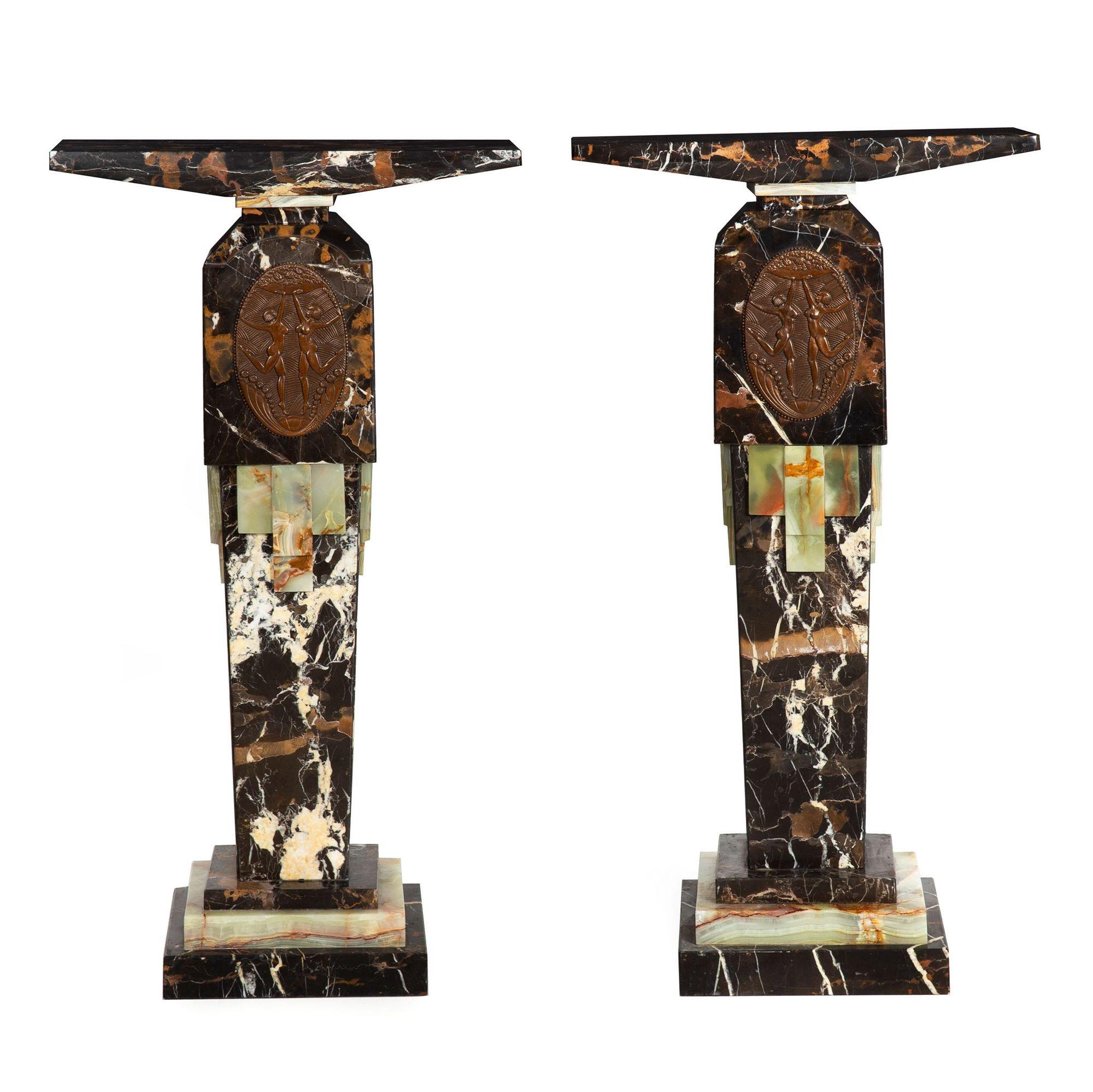 PAIR OF ART DECO STYLE STACKED MARBLE AND ONYX PEDESTALS WITH BAS-RELIEF PLAQUES OF DANCING MAIDENS
Both plaques signed 