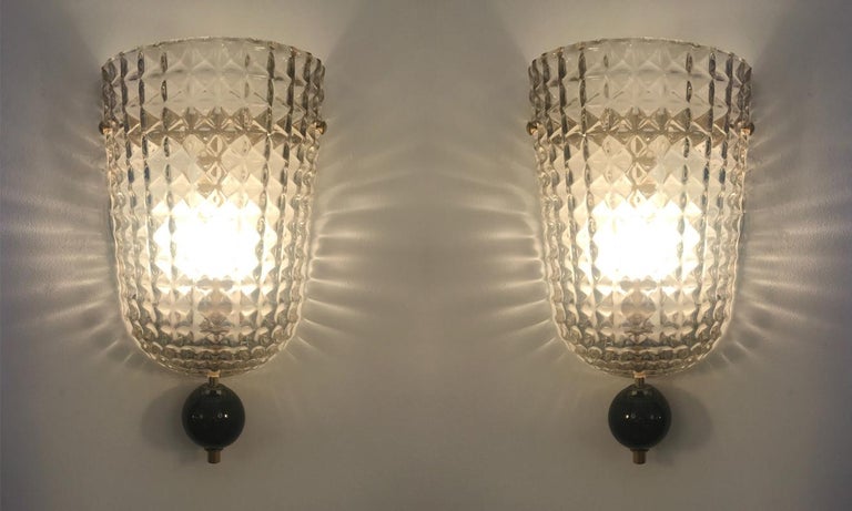 Pair of Art Deco style Murano glass demilune wall sconces, in stock
Black glass sphere and brass fittings.
Textured Murano glass,
Wired to the American standard
Located in our store in Miami ready for shipping.

