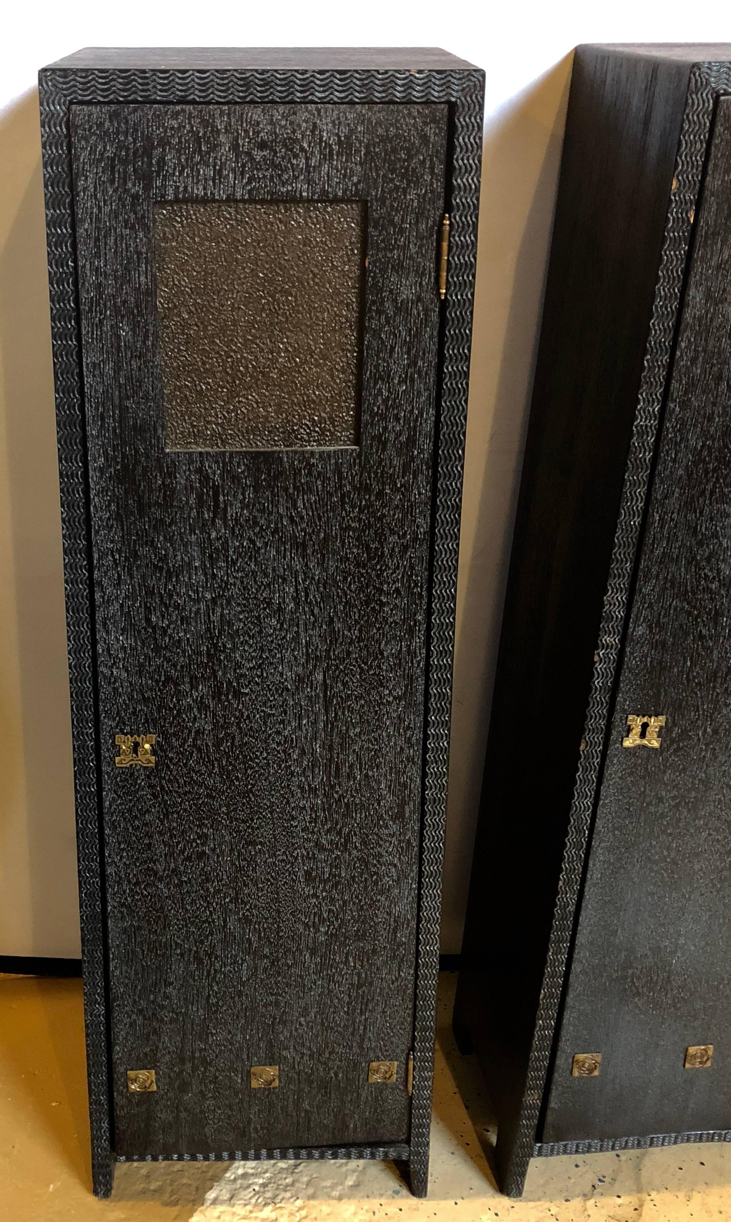 Pair of Art Deco style pedestal cabinets prov. Christies NYC (see sticker). Each pedestal opens to reveal storage. 

Ebonized Oak, Gilt Metal
20th C.