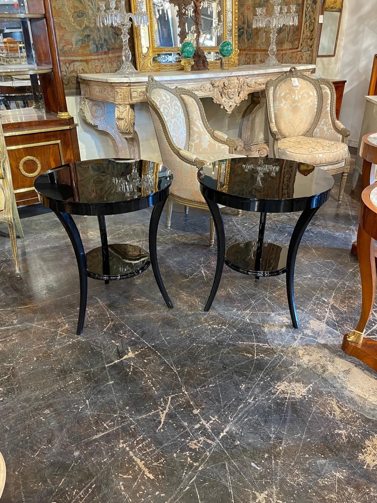 Stylish pair of Art Deco style piano black side tables. Exceptional finish and gorgeous lines on these. Perfect for an elegant home!