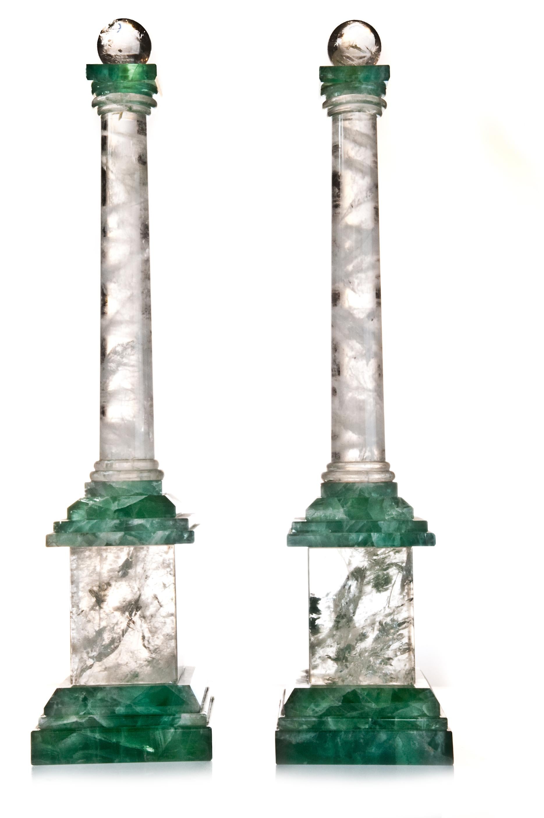 A pair of large Art Deco style cut rock crystal and green quartz obelisks.