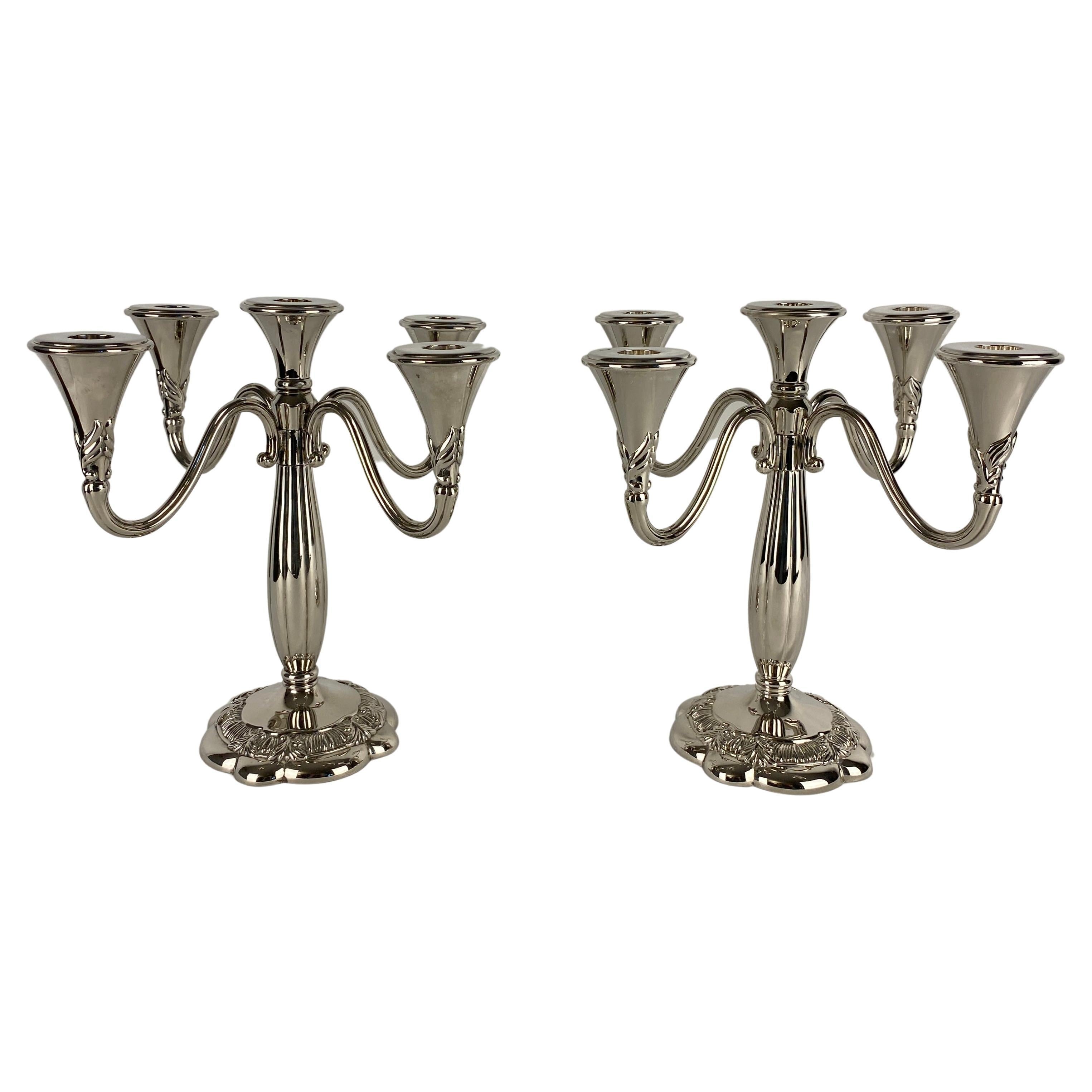 A handsome pair of Art Deco style 5 arm candelabras. 

This fine pair of Royal Gallery Vintage Post Modern Candle Holders are of very good quality. 
Round bases with Art Deco form.
Bears the maker's mark. 

Very good condition, minor surface