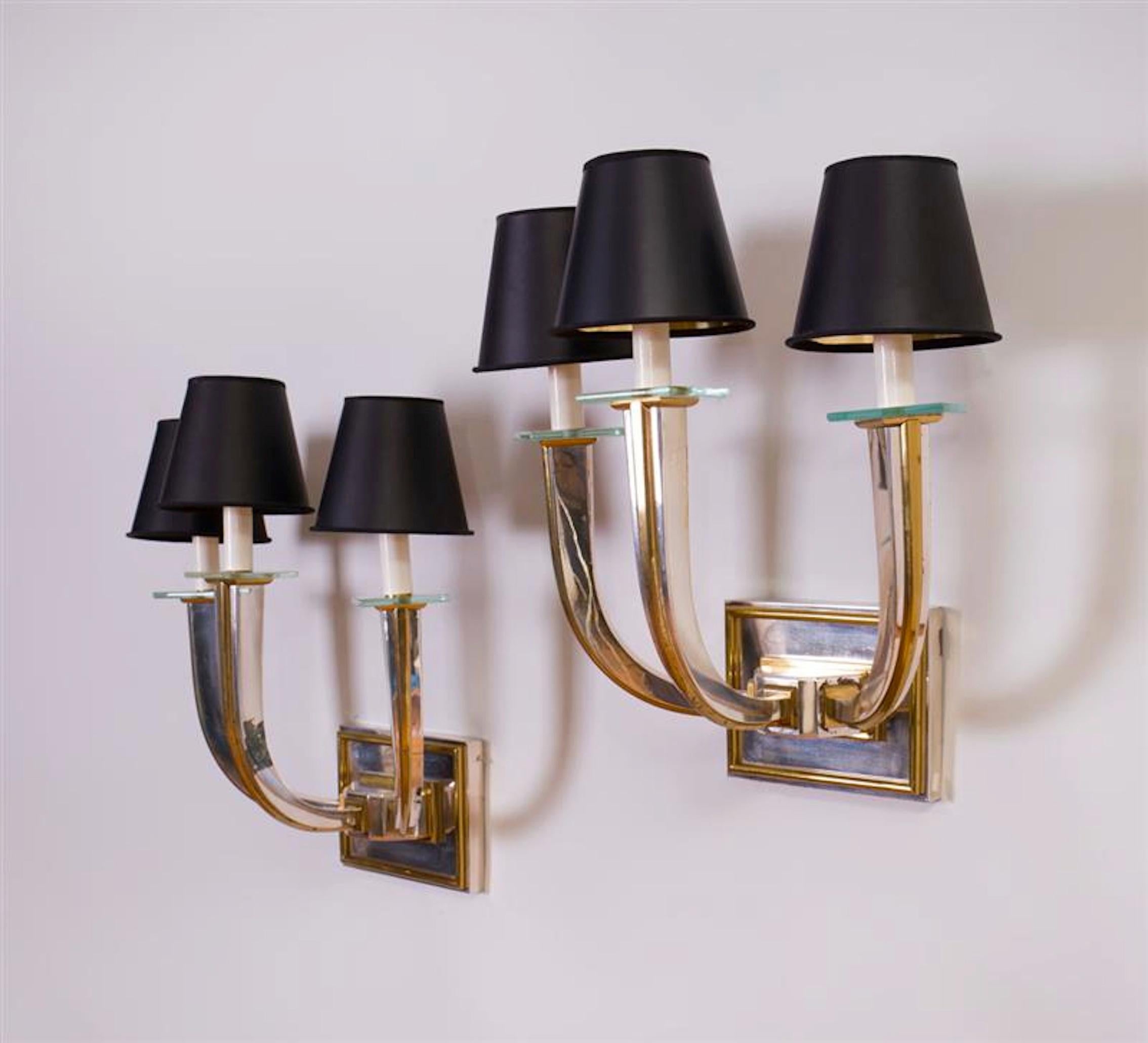 Pair of Art Deco style silvered metal, brass and glass three-light sconces. 


 