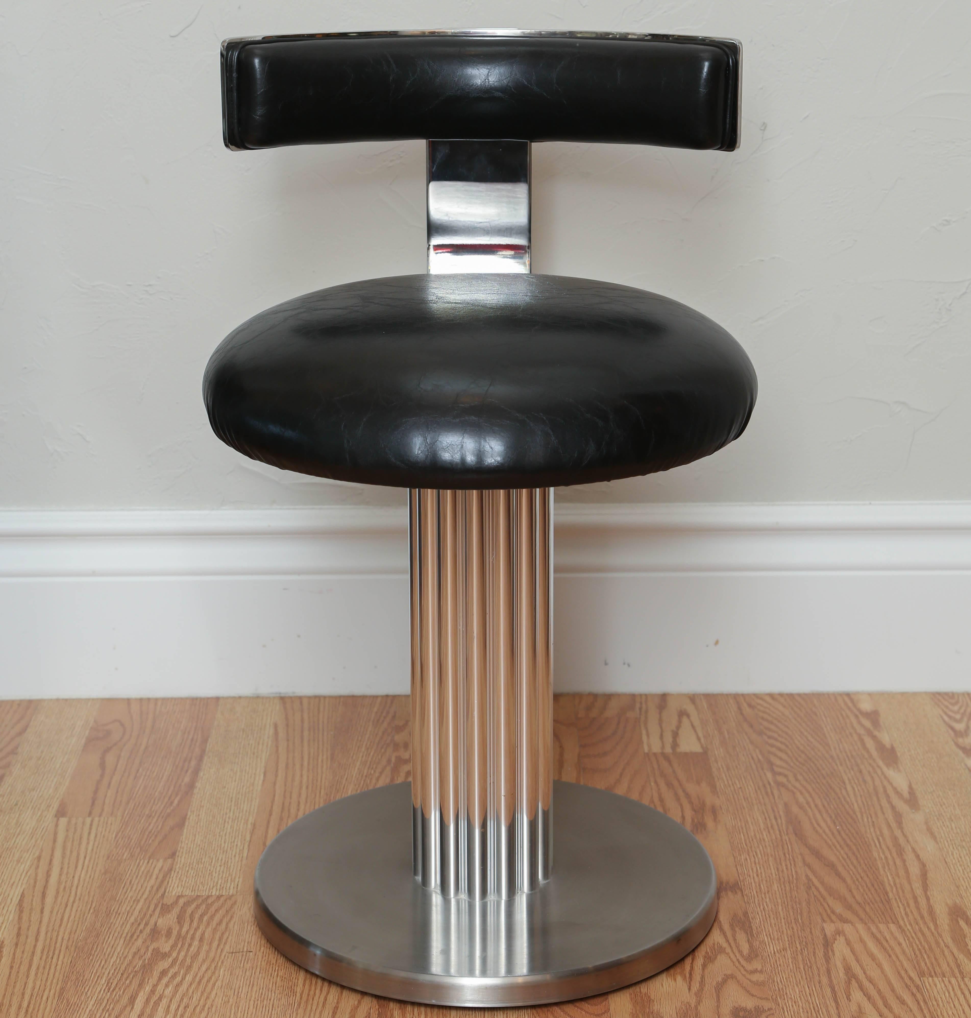 Pair of polished steel and chrome Art Deco style stools or swivel chairs with black leather seats and back.