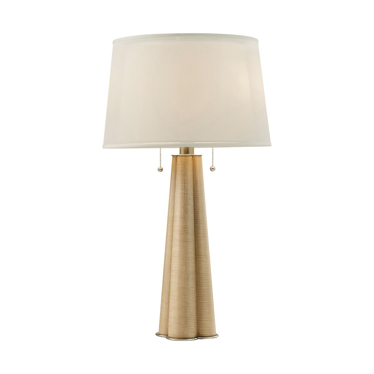 A beacon of 20th-century sophistication reimagined for the modern home. Inspired by the understated luxury of the 1920s, this lamp boasts a tapered cluster column form in a light sesame finish.

Whether it's enhancing a cozy corner or used next to