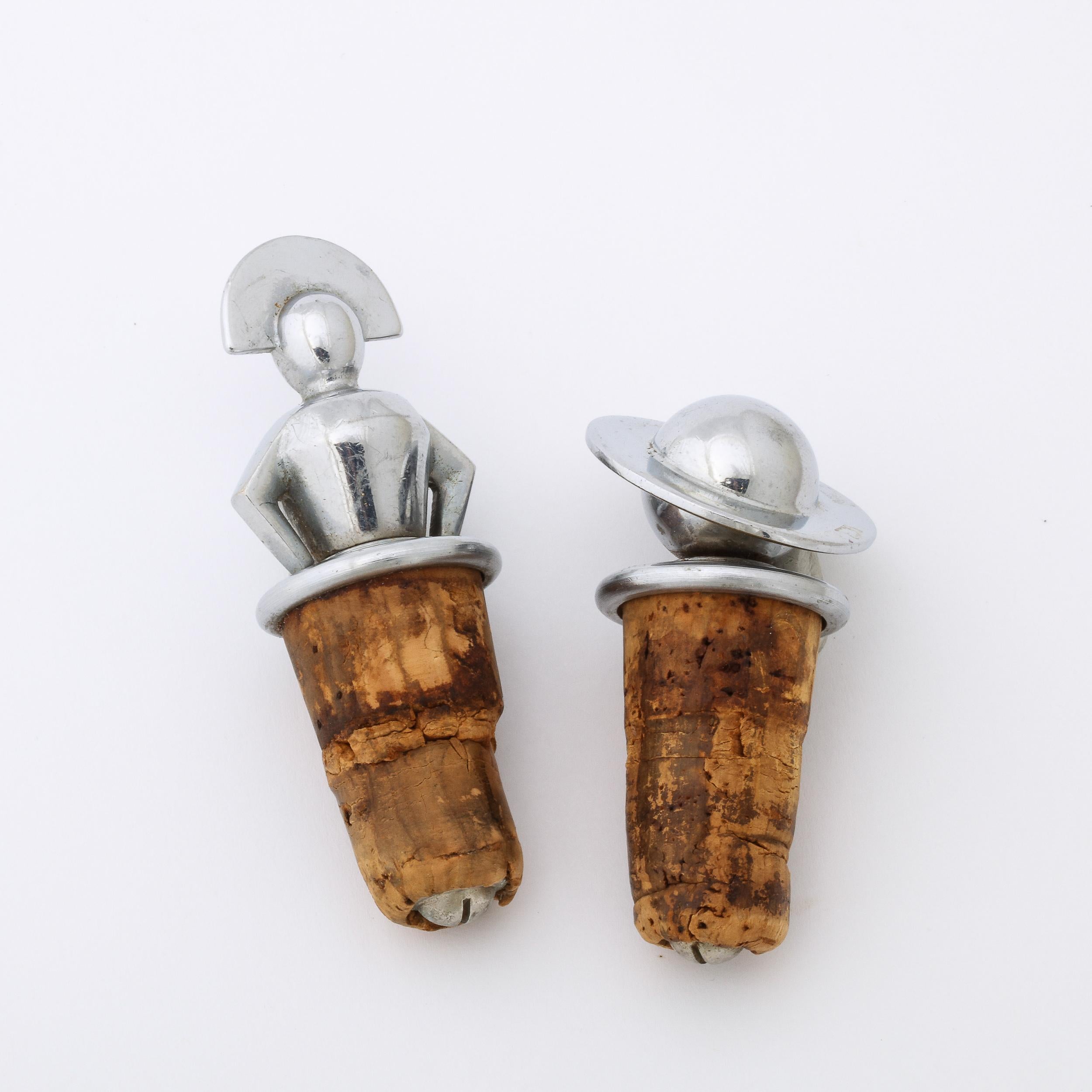 This charming pair of Art Deco Wine Stoppers Originates from the United States Circa 1930, beautifully fabricated in Polished Chrome.  The art deco period produced some of the most beautiful and sought after pieces of artwork ever made. These wine