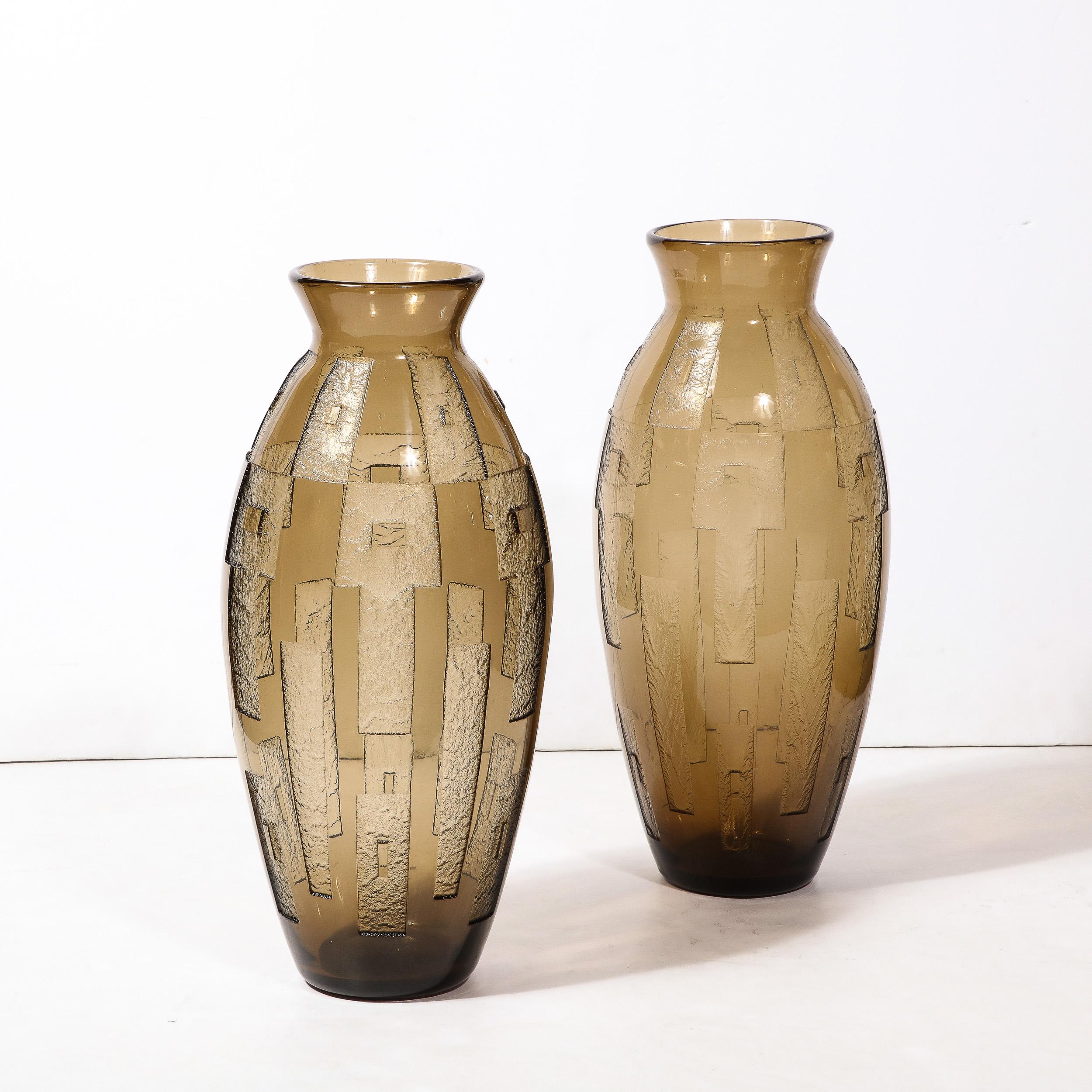 -This very rare pair of Art Deco Cubist style Acid Etched Vases originate from the esteemed Art Glass Company Daum in Nancy, France, Circa 1930. Unbelievable in scale, profile, unmatched technical execution, and rarity.  Executed in acid etched