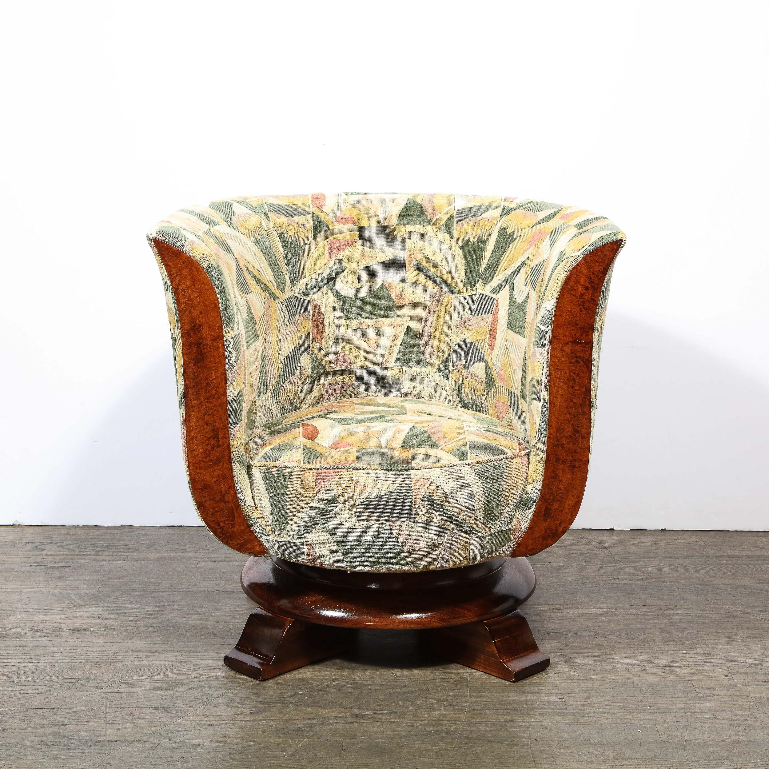 This stunning and graphic pair of lounge chairs were realized in Belgium circa 1930 for the Le Malandre hotel They feature four curvilinear stout feet that connect to a circular platform all in radiant tulipwood. The base is topped with a circular