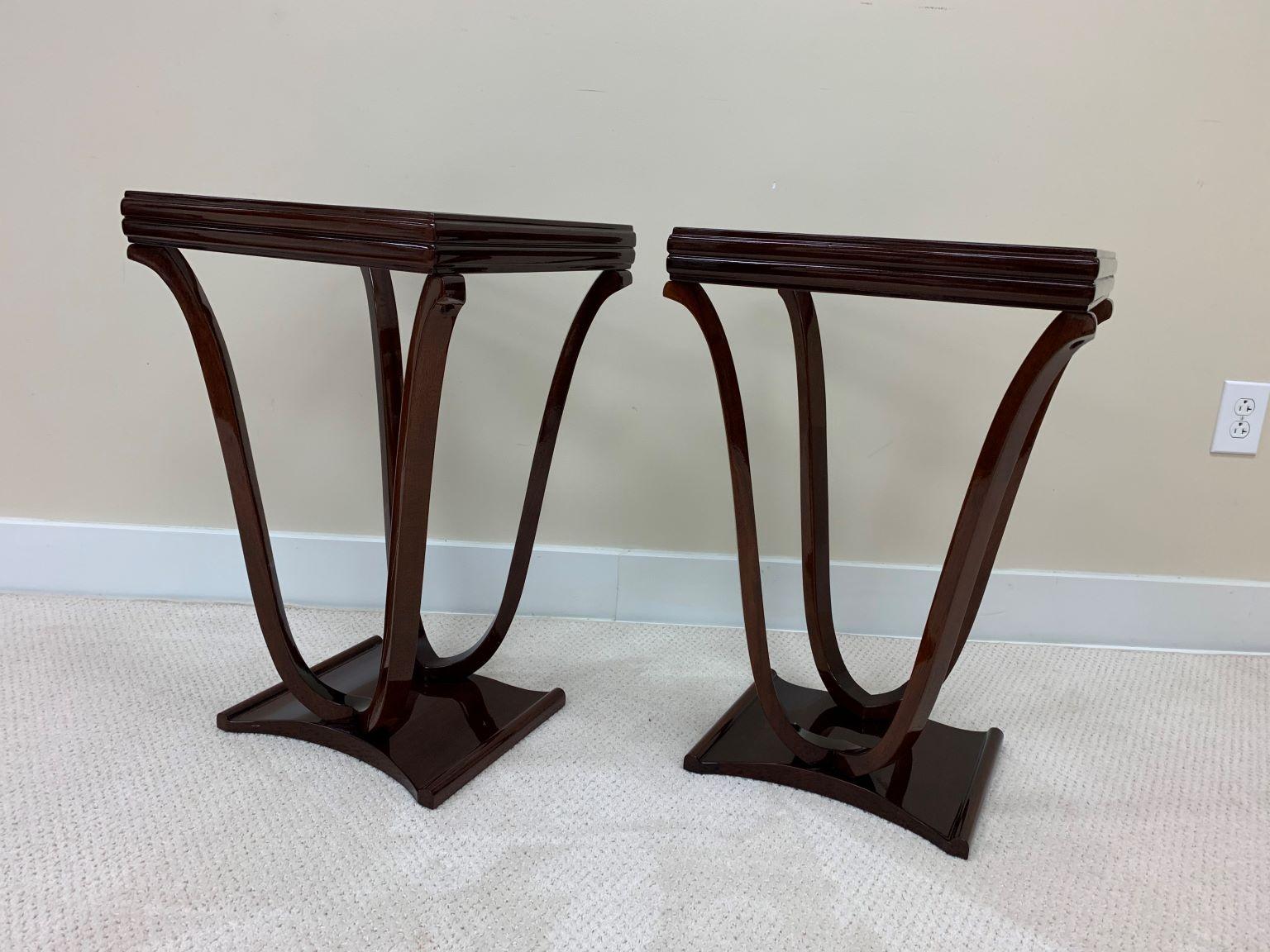 Pair of Art Deco tulip shaped glass top end tables. A new glass top with a frosted edge highlights the elegant curving legs of this beautiful American Art Deco  table. from the 1930's. The solid maple wood is expertly restored in a walnut gloss