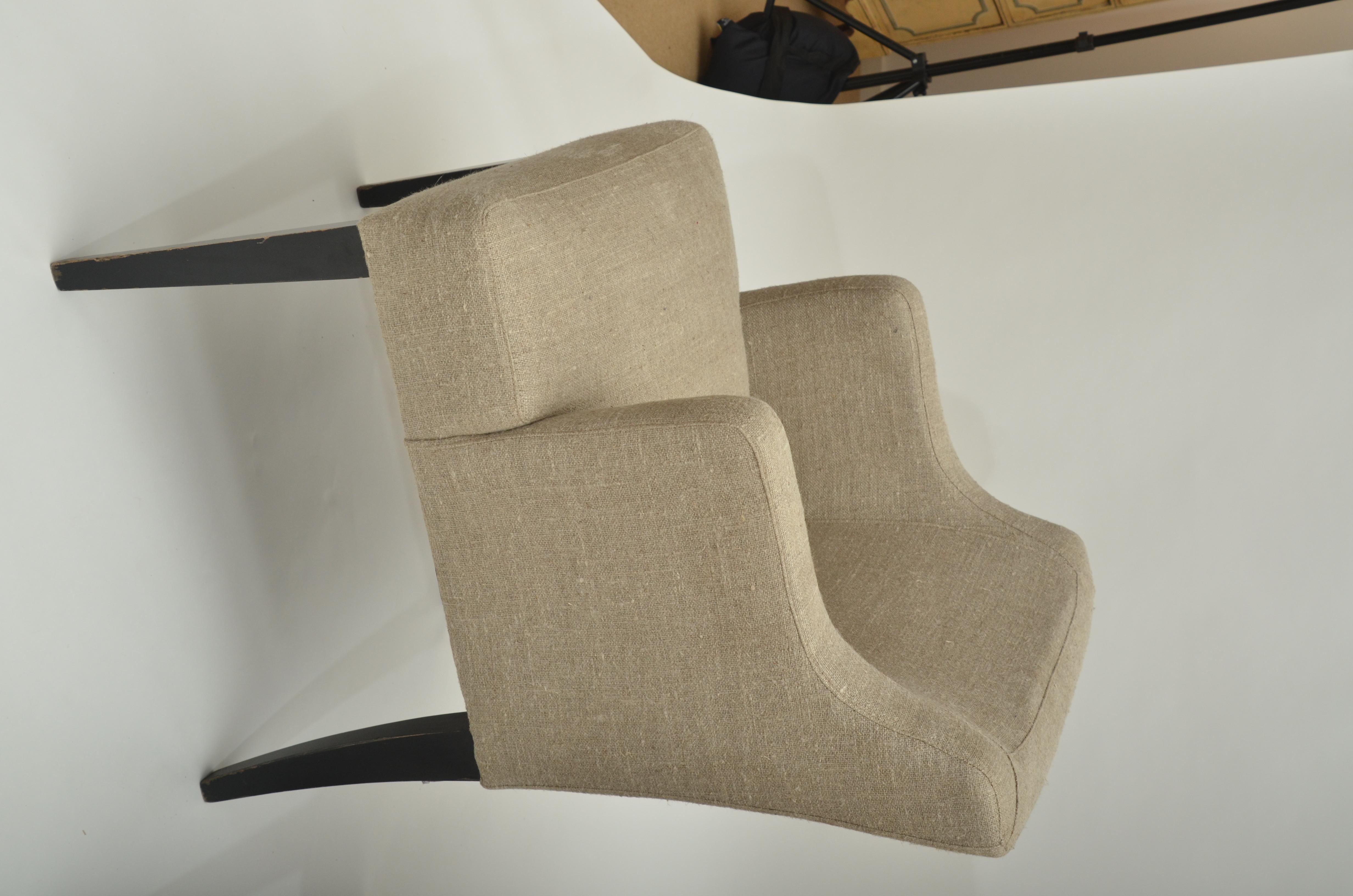 Armchairs have ebonized tapered legs and are newly upholstered in natural French linen.