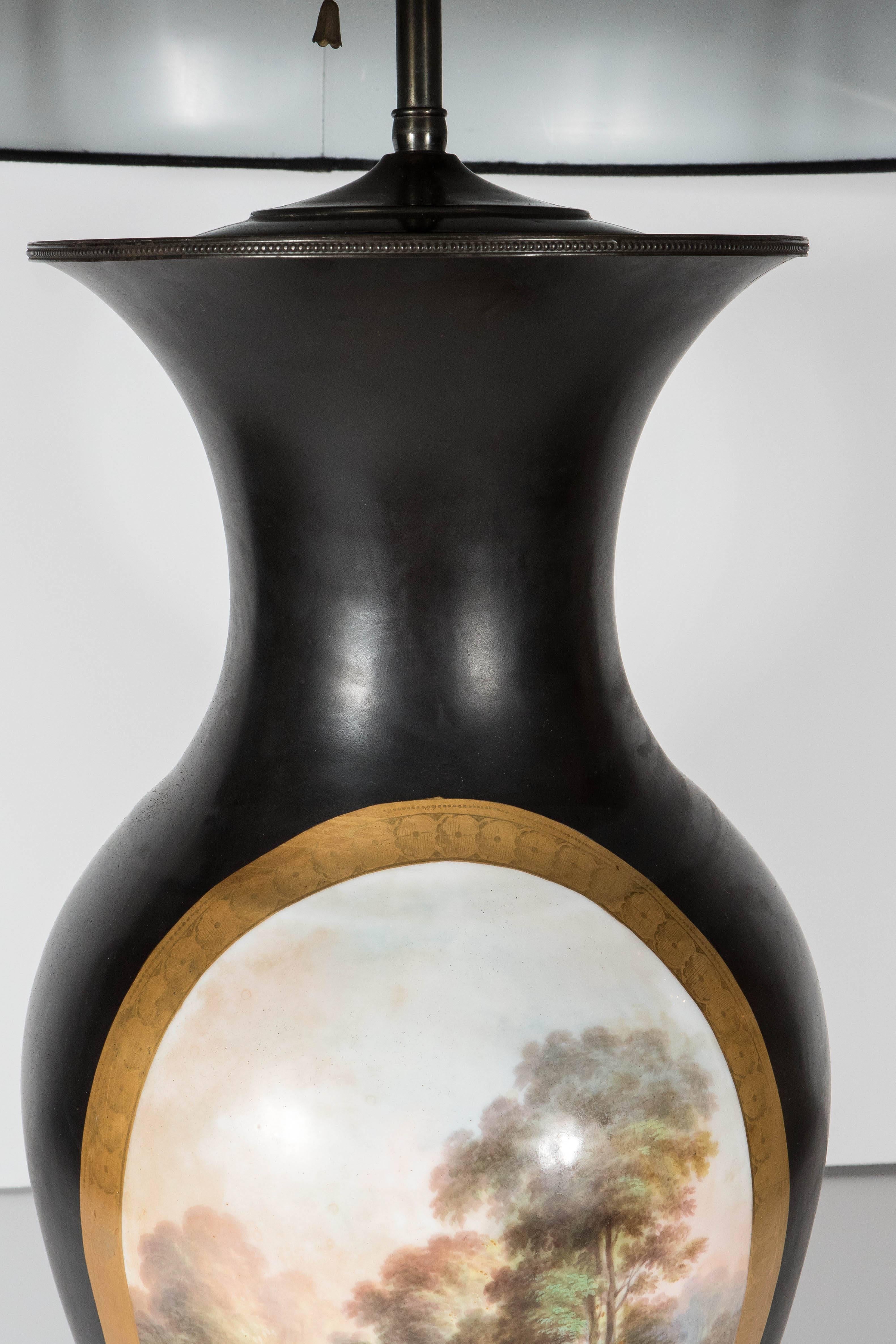 Porcelain Pair of Art Deco Urn Form Black Bisque Glaze Table Lamps with Pastoral Scene