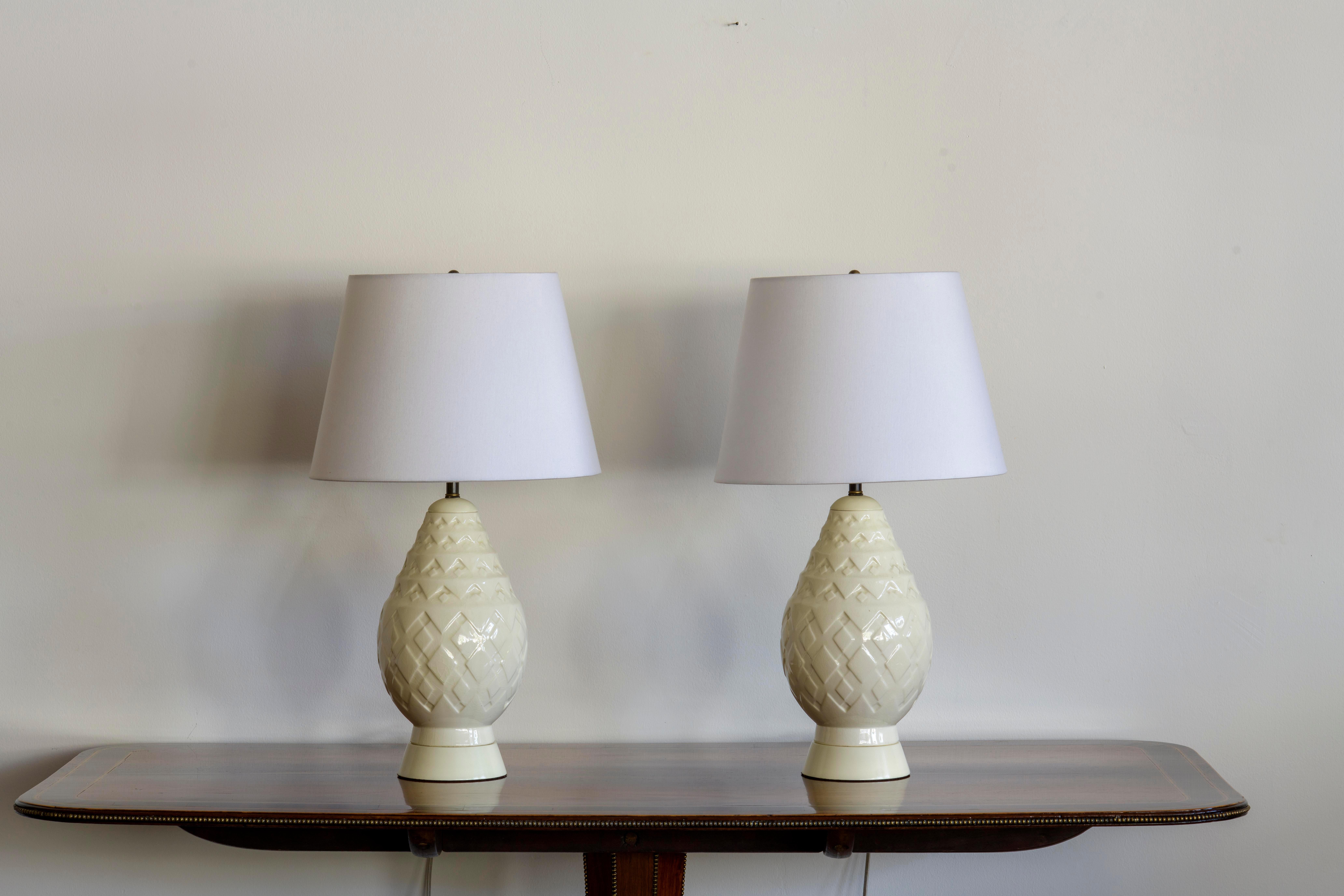 Pair of Art Deco vases by Charles Catteau converted to lamps.  Charles Catteau trained at the National Ceramics School in Sèvres and followed a training course at the National Porcelain Factory in the same town. In 1904, Catteau was hired by the