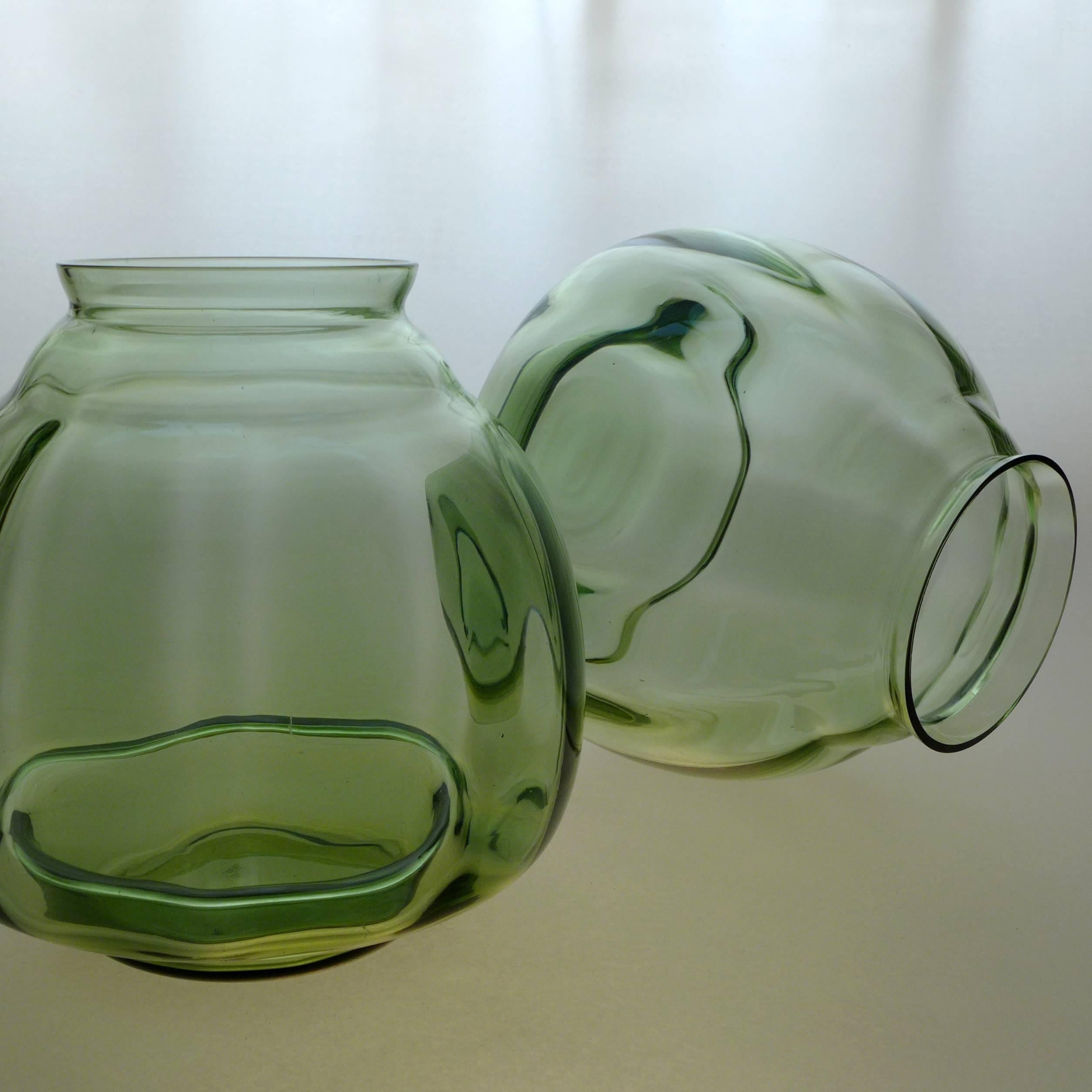 A pair of Dutch Art Deco flora vases designed by A. D. Copier.

Andries Dirk Copier is one of the most revered glass designers of his time, a leader in the Art Deco ‘Amsterdam School’ style. Leerdam glass is known for clean, simple, organic forms