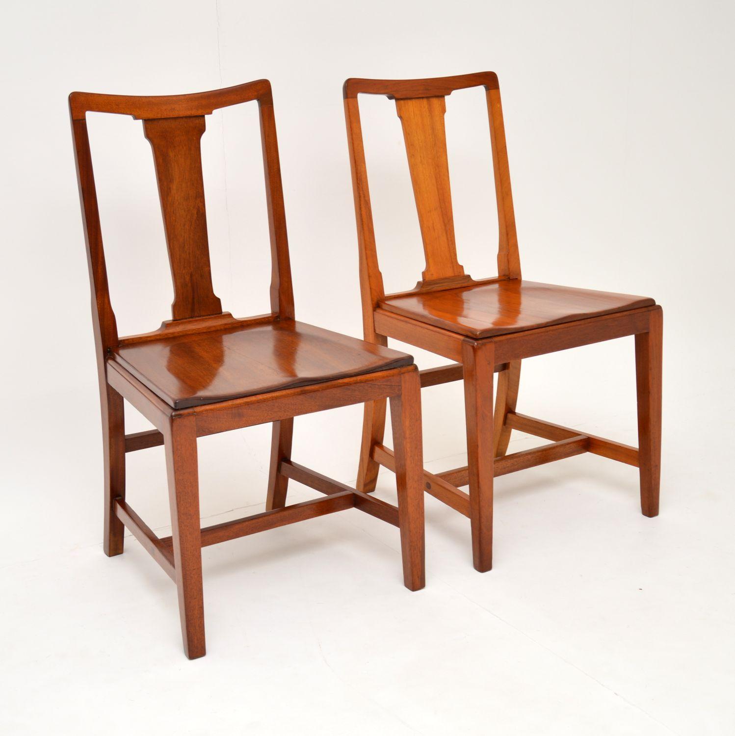 A handsome and unusual pair of Art Deco period side chairs, these are of amazing quality and are solid mahogany throughout.

They are stamped beneath the seat: 1937 H(F)Ltd and have the royal stamp of approval from the king at the time Edward