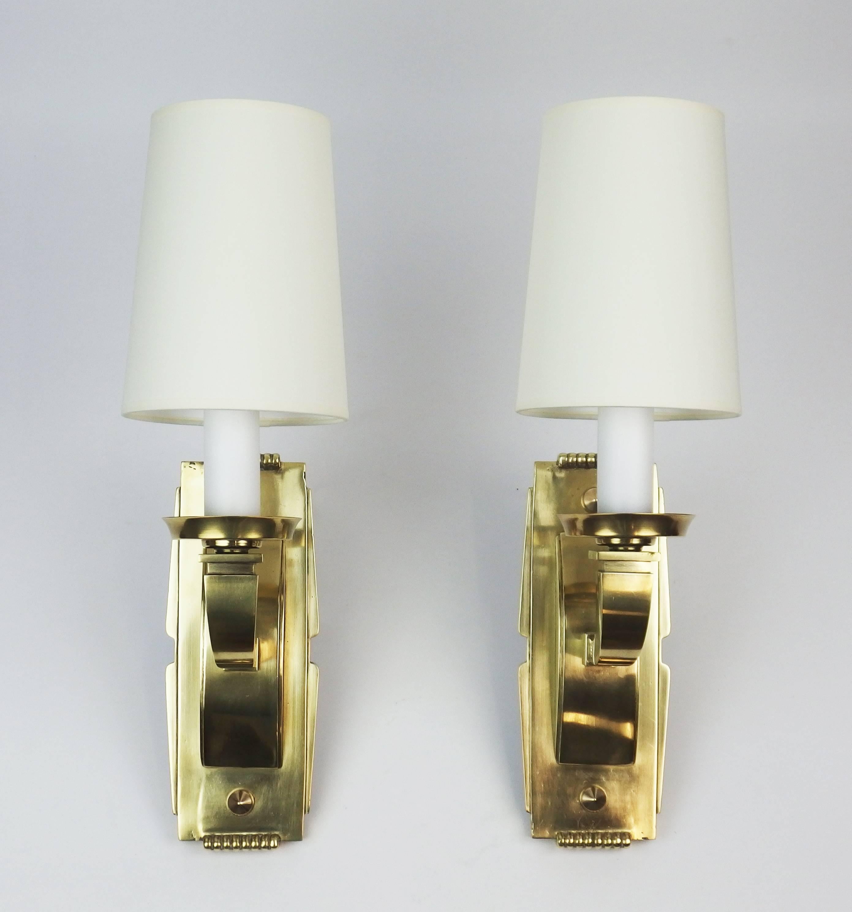 A pair of bronze and brass Art Deco sconces.
Height of sconce without the shade: 14.5 inches.
 