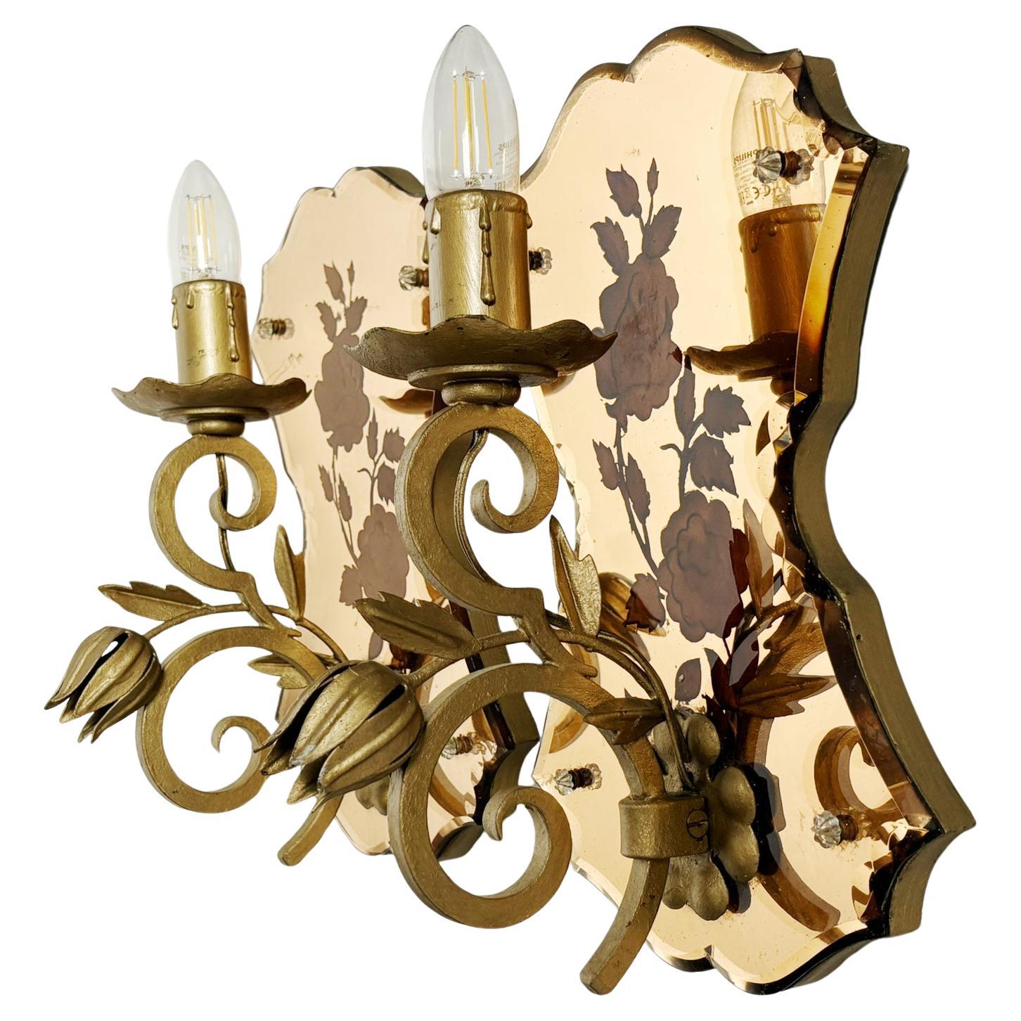 Pair of Art Deco wall sconces in patinated gold metal and glass, France, 1950 For Sale