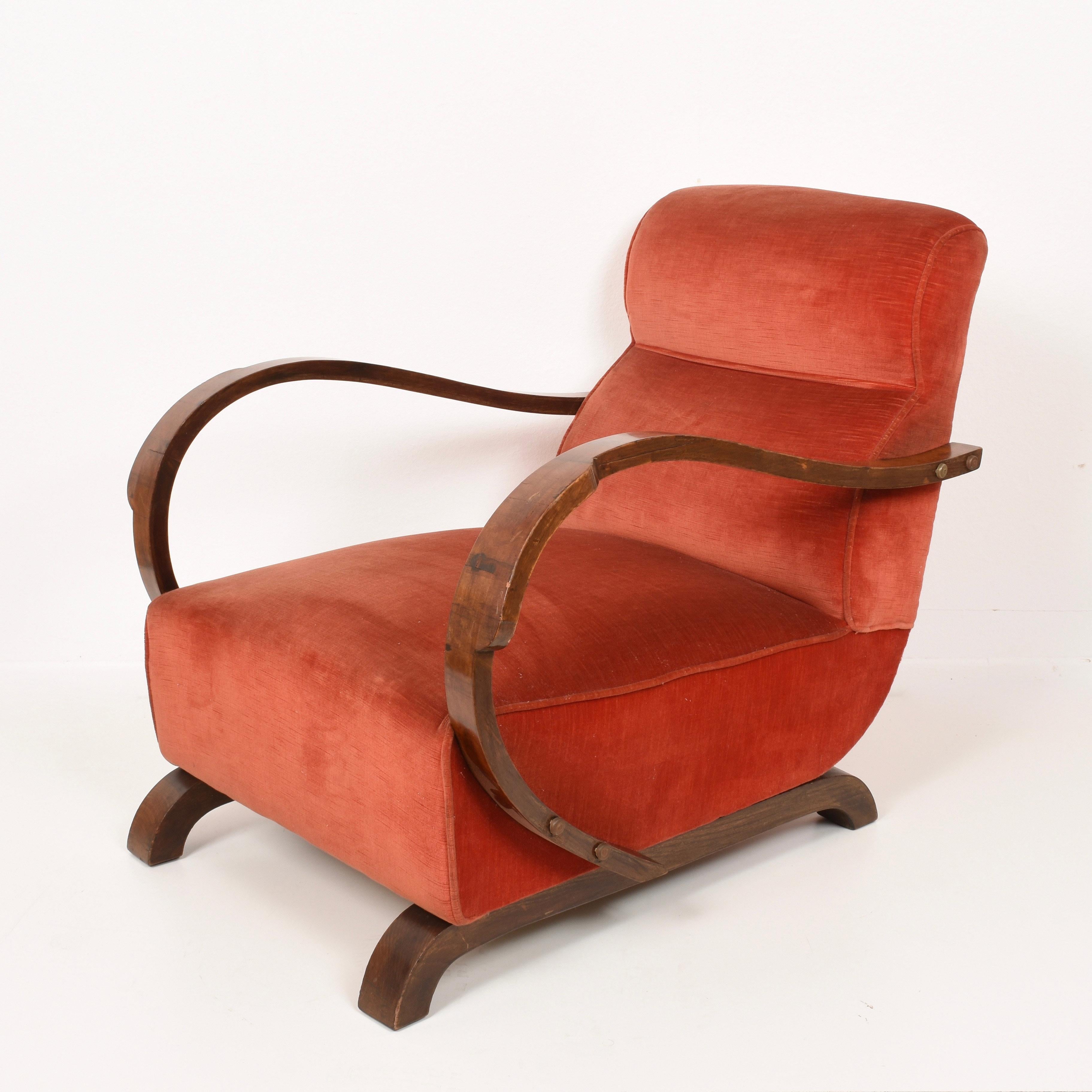 Pair of Art Deco walnut and red fabric armchairs and ottoman. This wonderful set was produced in Italy during the 1930.

The fabric of the ottoman is different from the chairs, both for color, as it is salmon pink, and type of fabric.

The more
