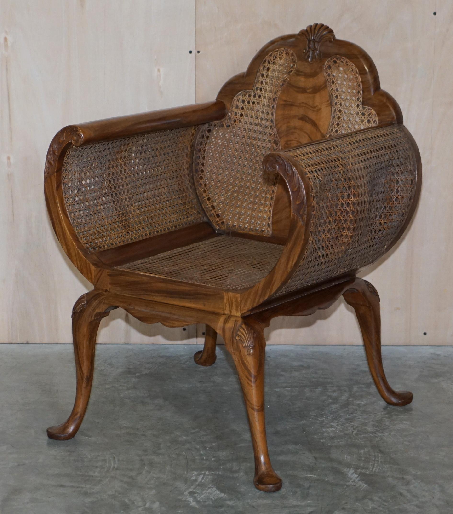We are delighted to offer for sale this stunning pair of Art Deco Walnut, Rosewood and Bergère curved occasional armchairs

Each piece has beautifully sculpted curved arms with nice carvings on, the seat cushions are over stuffed feather filled,