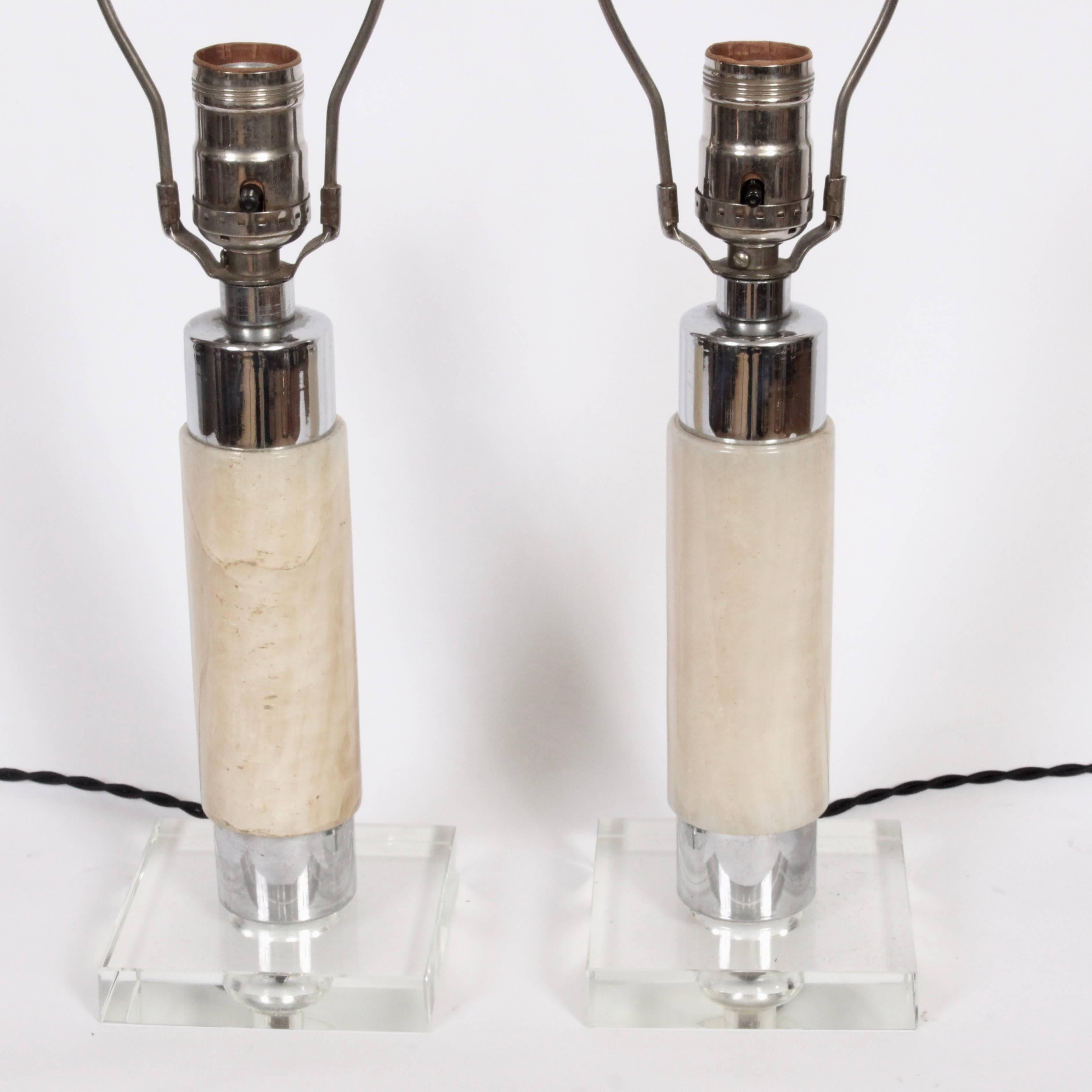 Smaller pair of Hollywood Regency Onyx, Crystal and Chrome Table Lamps. Featuring a natural, Parchment toned Onyx wrapped column, original reflective Chrome Plated hardware with clear Crystal bases and Crystal ball finials. 11.5 H to top of socket.