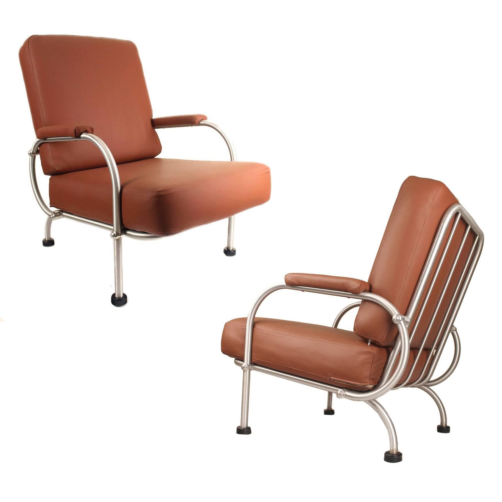 Warren McArthur Biltmore armchairs age, restored with caramel tone leather, aluminum frame.  Originally from a Southwest bell telephone office (original inventory labels on frame )In the late 1920s, Albert Mc Arthur began work on the famed Arizona