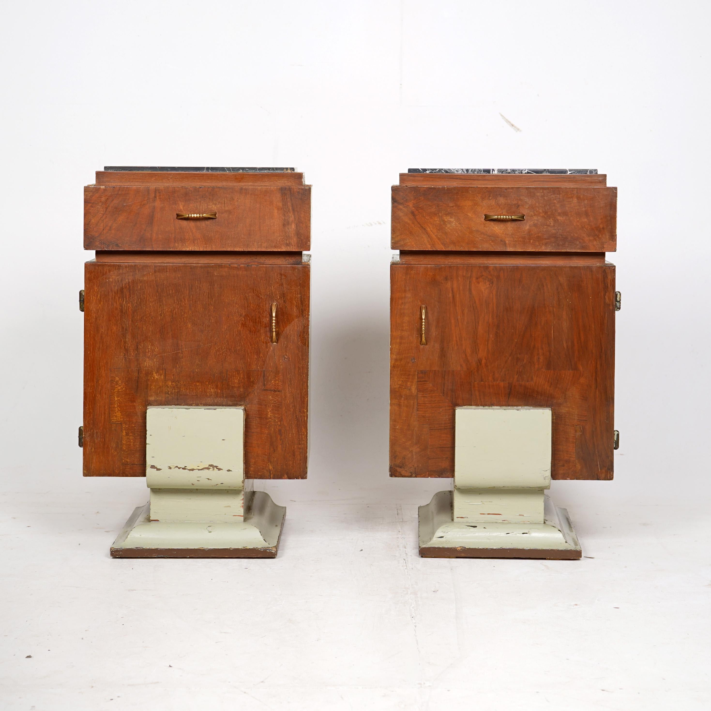 Pair Art Deco Bedside Tables. 1930s Italian bedside tables with marble tops. Walnut veneer front, sides and base in the past have been painted green which has worn nicely. Original brass handles on the door and drawer.

Condition 
Please do take a