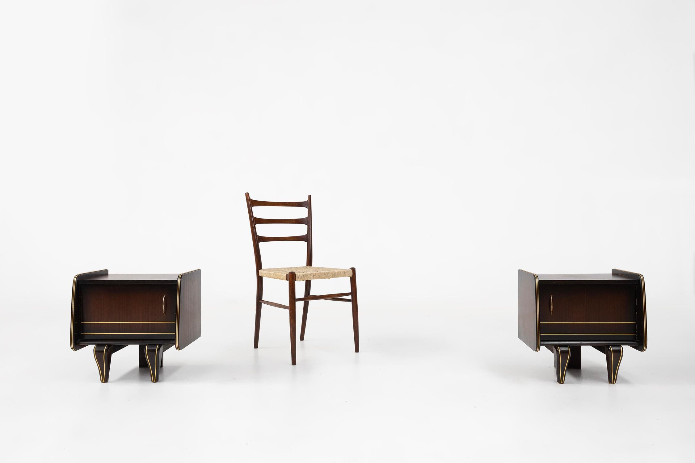 Belgium / 1940 / pair of nightstands / wood / Art Deco

A pair of stunning Art Deco nightstands designed in Belgium in the 1940s. These two nightstands showcase a sleek silhouette with clean golden lines to contrast the warm wood with glossy finish.