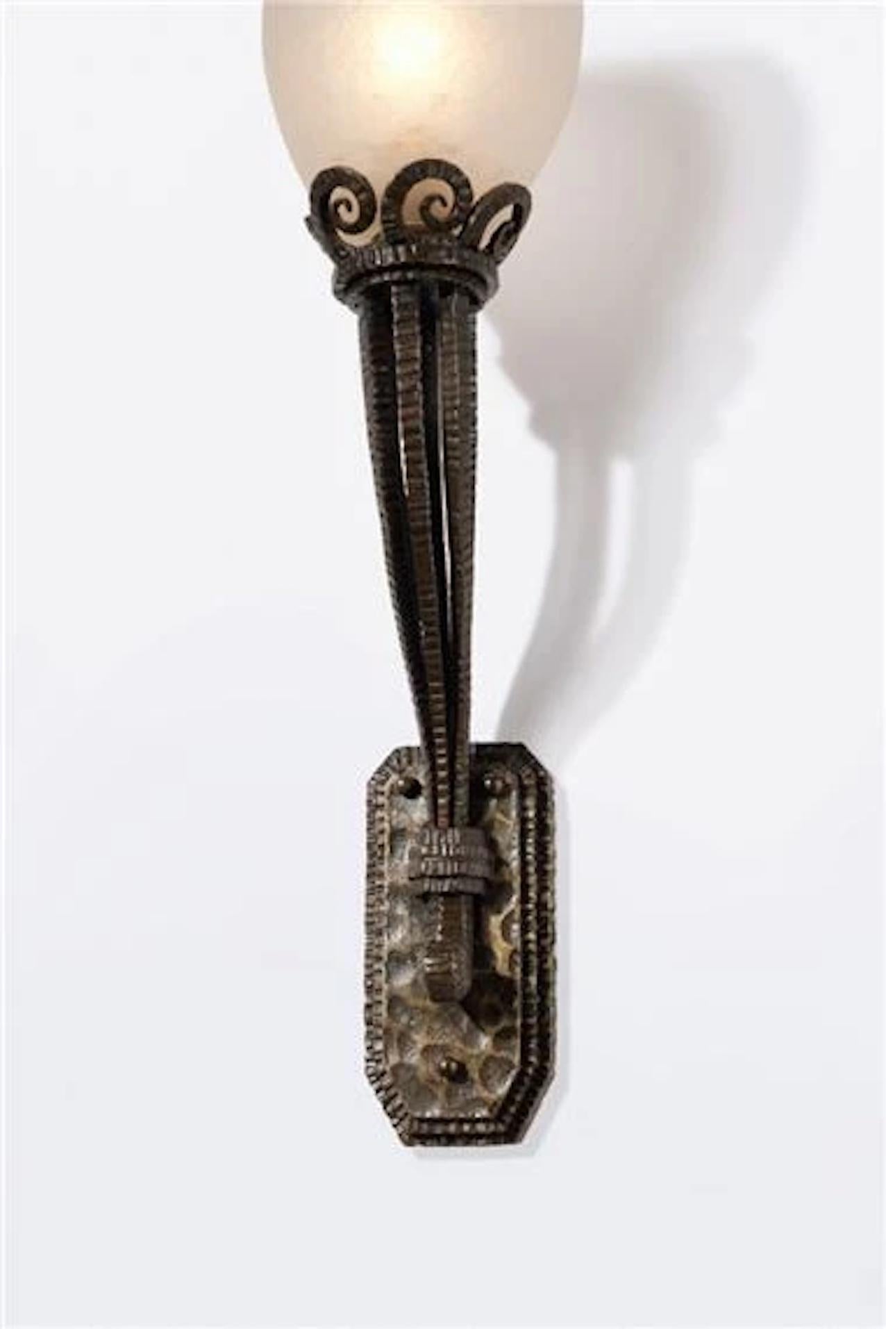 Pair of Art Deco patinated wrought ron and acid-etched glass sconces by Paul Kiss. one iron base twice impressed P. KIS/PARIS, each glass shade incised SCHNEIDER France : circa 1925 Property from an Important American Collection Provenance: Maison