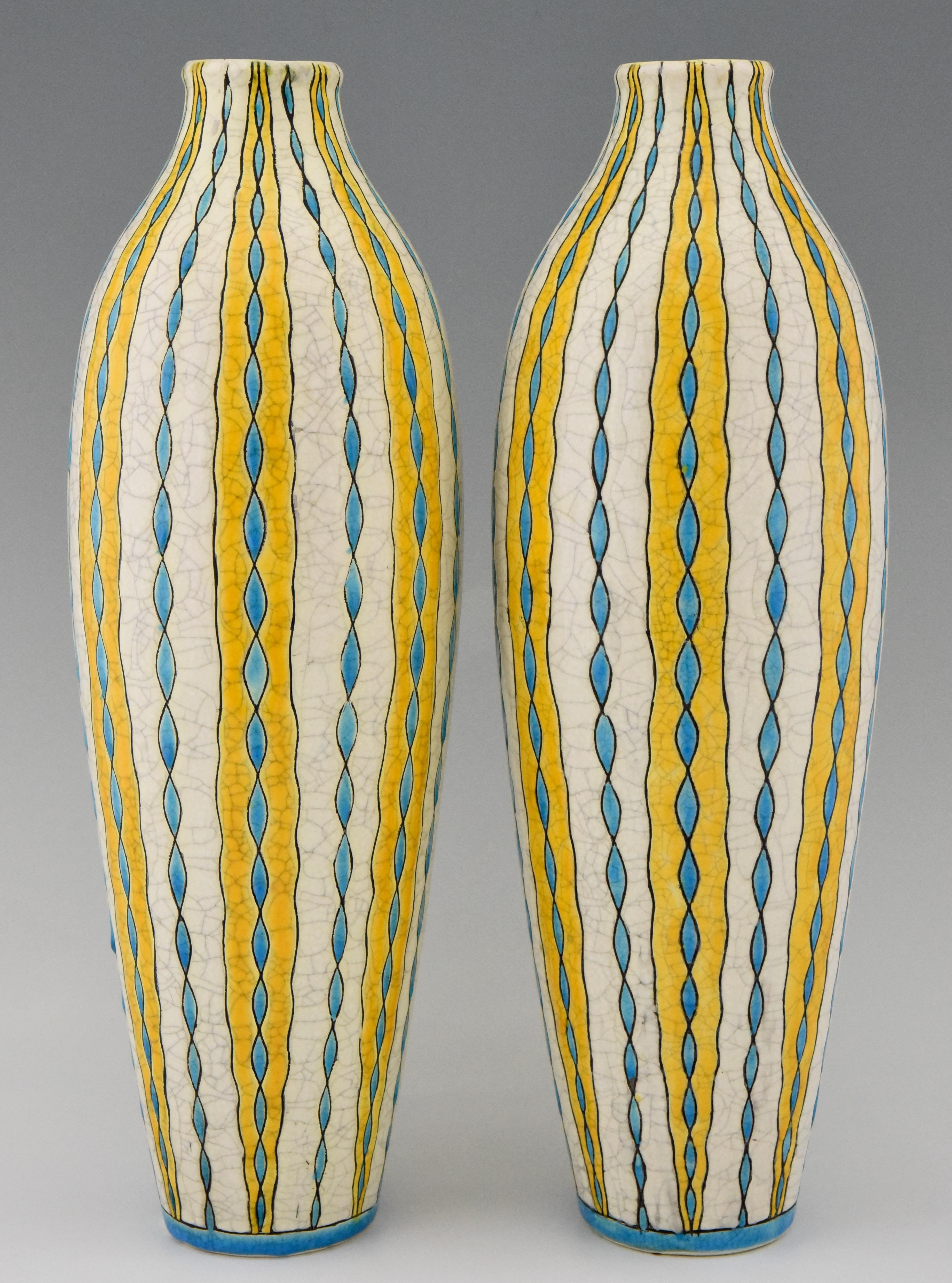 A pair of tall Art Deco vases in yellow, turquoise and white craquelé by Charles Catteau for Boch frères.
Belgium, 1923.
This decor is illustrated in ?“L'homme de Keramis” Charles Catteau by Dominique Corrieras “Catteau”, donation Claire de Pauw,