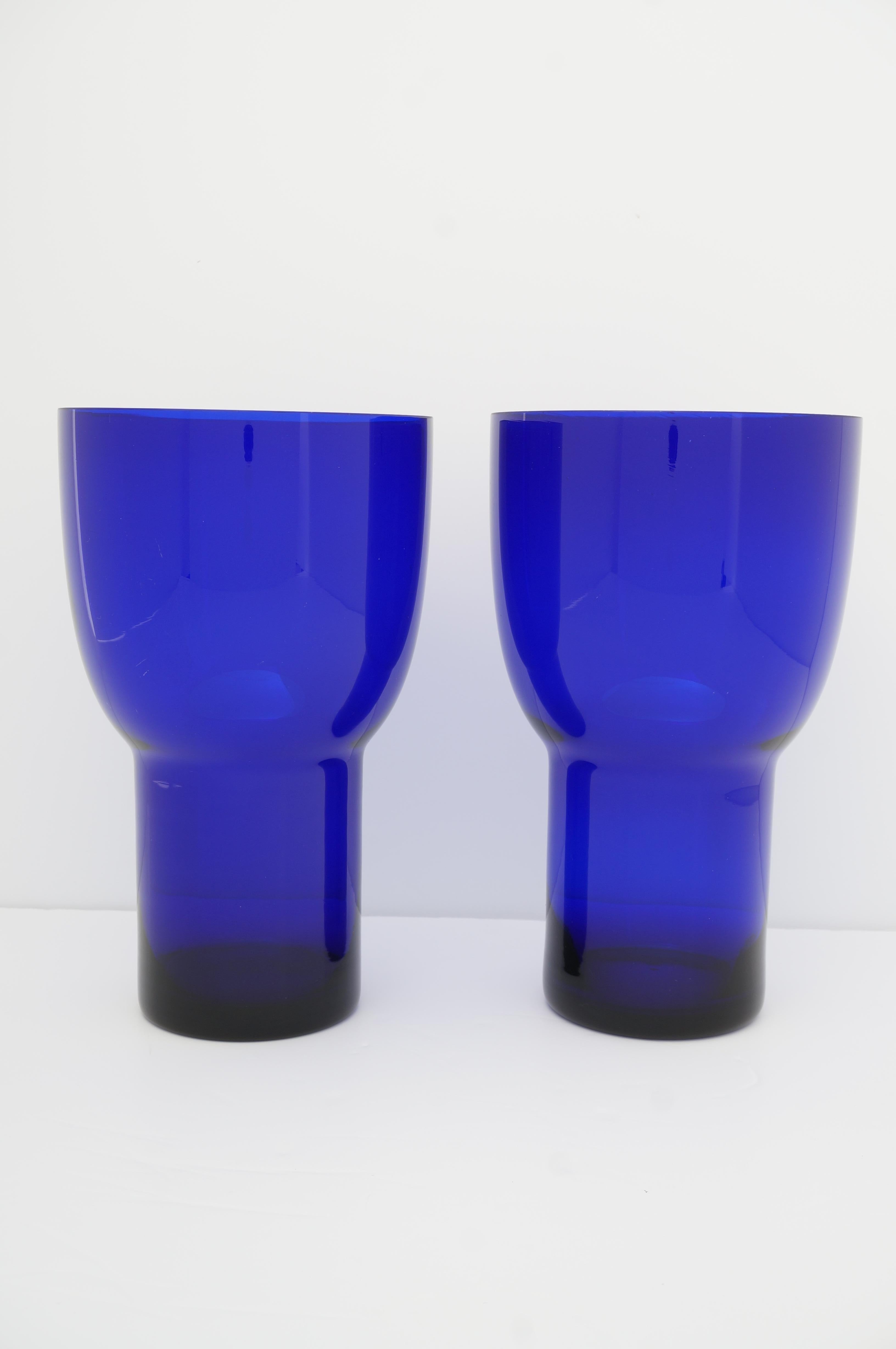 This stylish and chic pair of Art Deco cobalt blue glass vases date to the 1930s and are most likely from the Czech Republic, The form is clean and well balanced and they could be used as vases for flowers or as simple garniture.