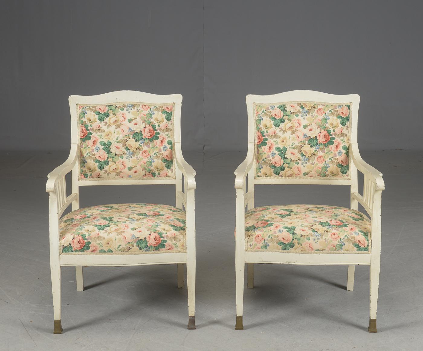 Wooden frame painted with brass food ends upholstered with flower fabric. Made in Germany in circa 1890-1900.