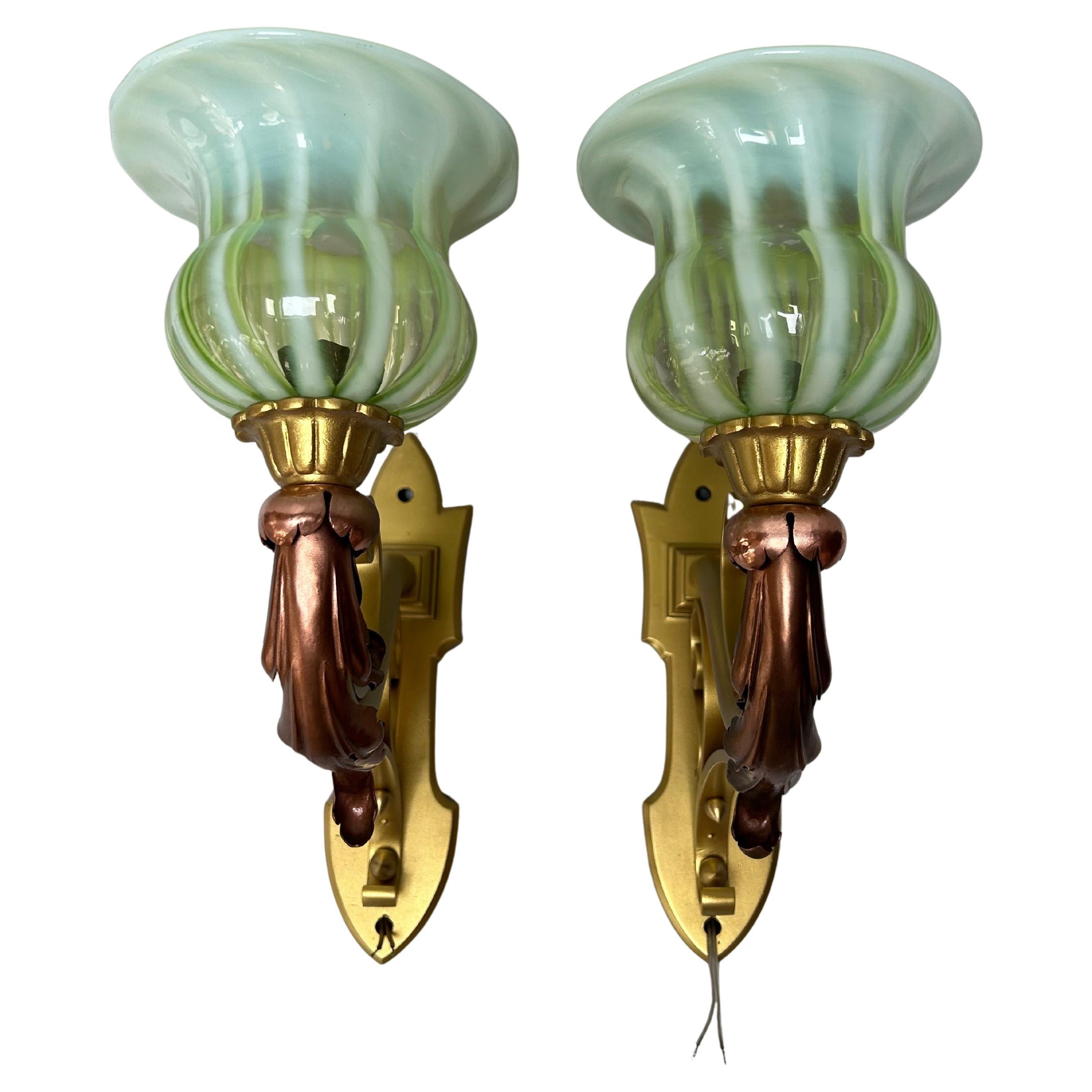 Pair of Art Nouveau bronze and copper sconces