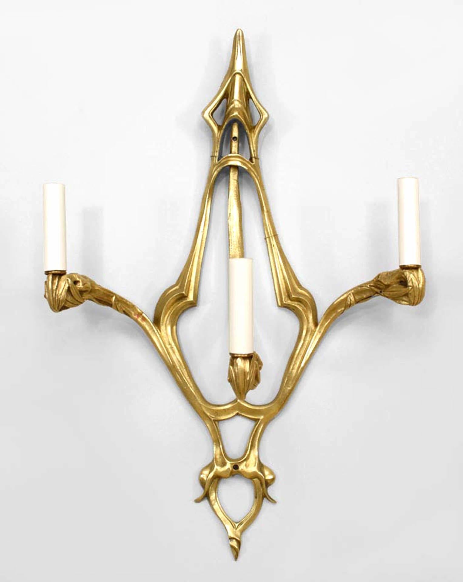 Pair of French Art Nouveau bronze dore wall sconces with thee arms and whiplash design.
