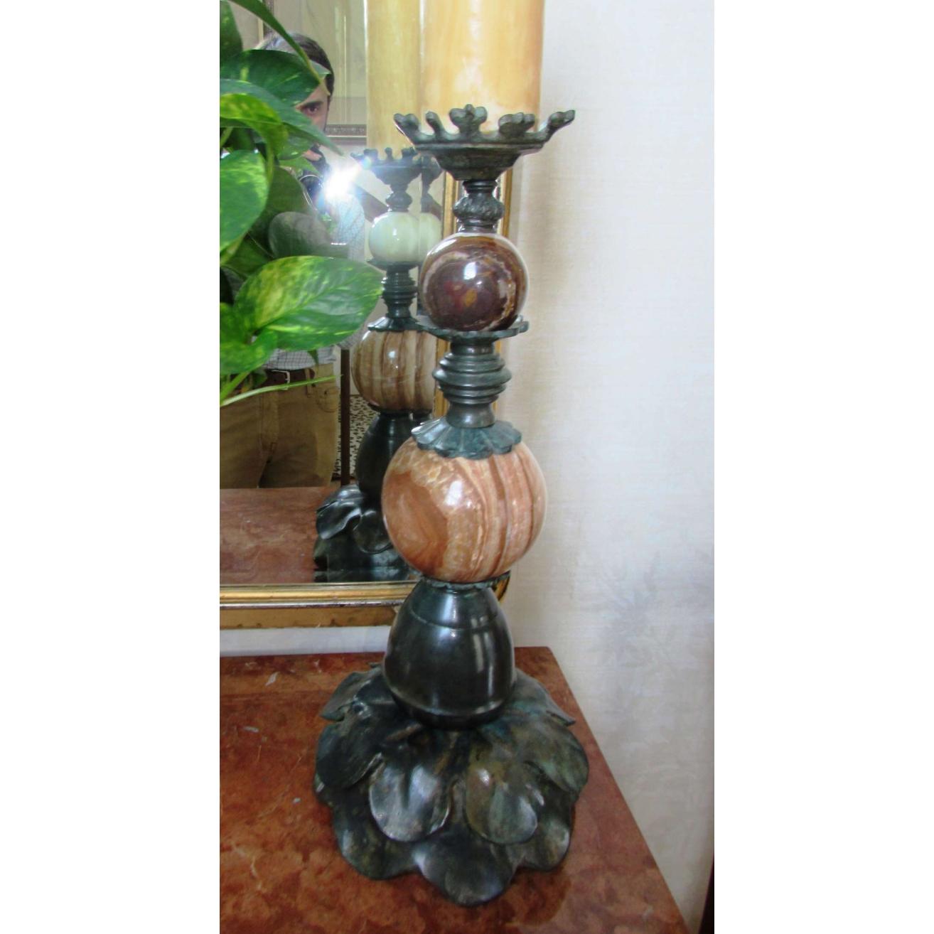 A pair of tall Art Nouveau bronze candlesticks with white and orangish-brown marble spheres.  Continental, circa 1890-1930.  Measuring approximately 21.5