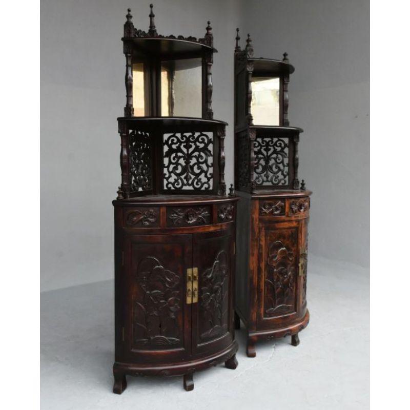 Pair of carved Art Nouveau corner cupboards circa 1900 decorated with flowers and openwork edges. Dimension height 185 cm for a depth of 467 cm. Probably Indochinese work

Additional information:
Style: Art Nouveau 
Material: Walnut.
 