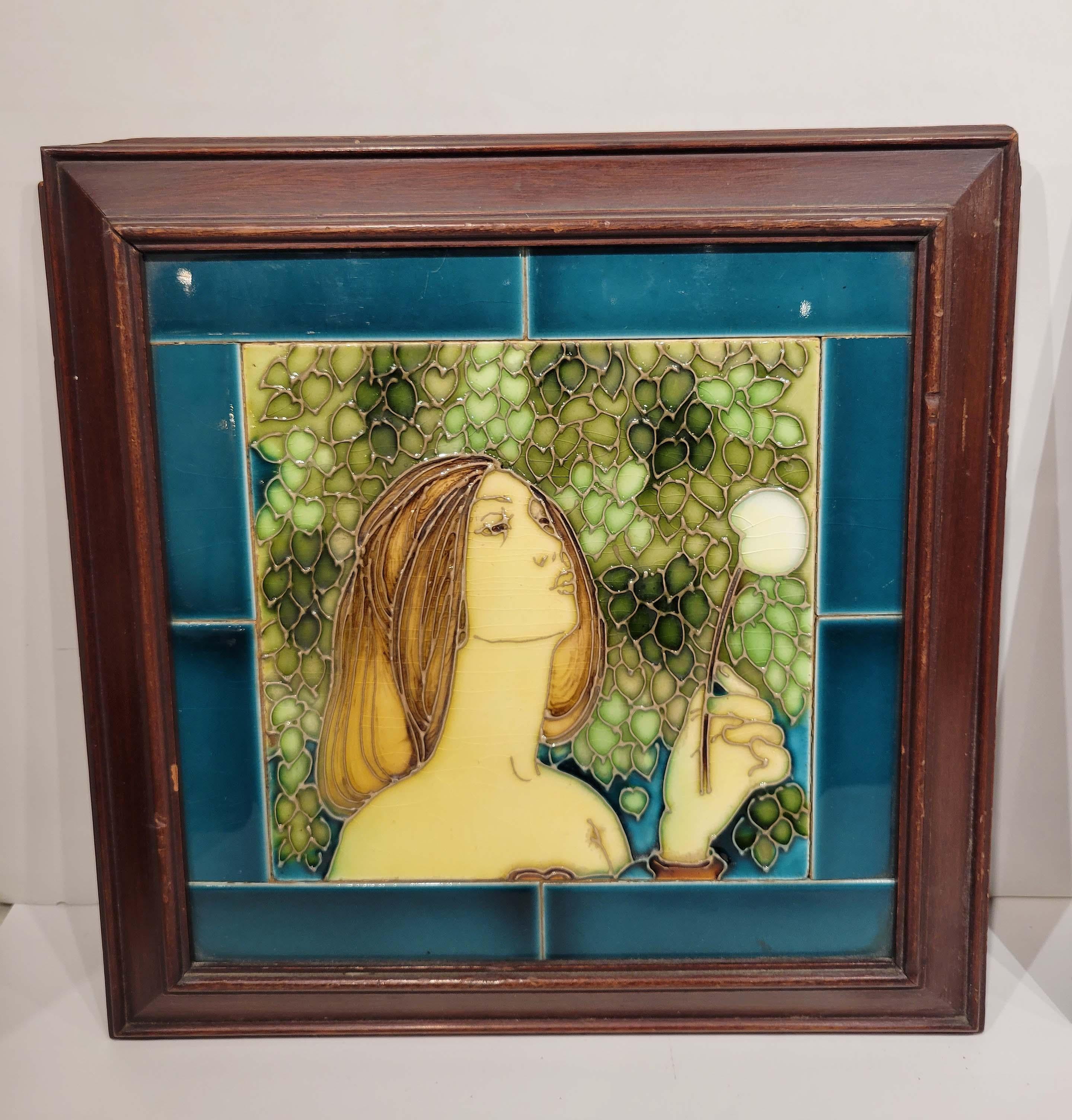 This pair of English ceramic tiles each depicting a beautiful maiden blowing on what it seems to be dandelions are framed in their original frames and date to the end of 19th century.
We have not opened the back to see if there are any marking on
