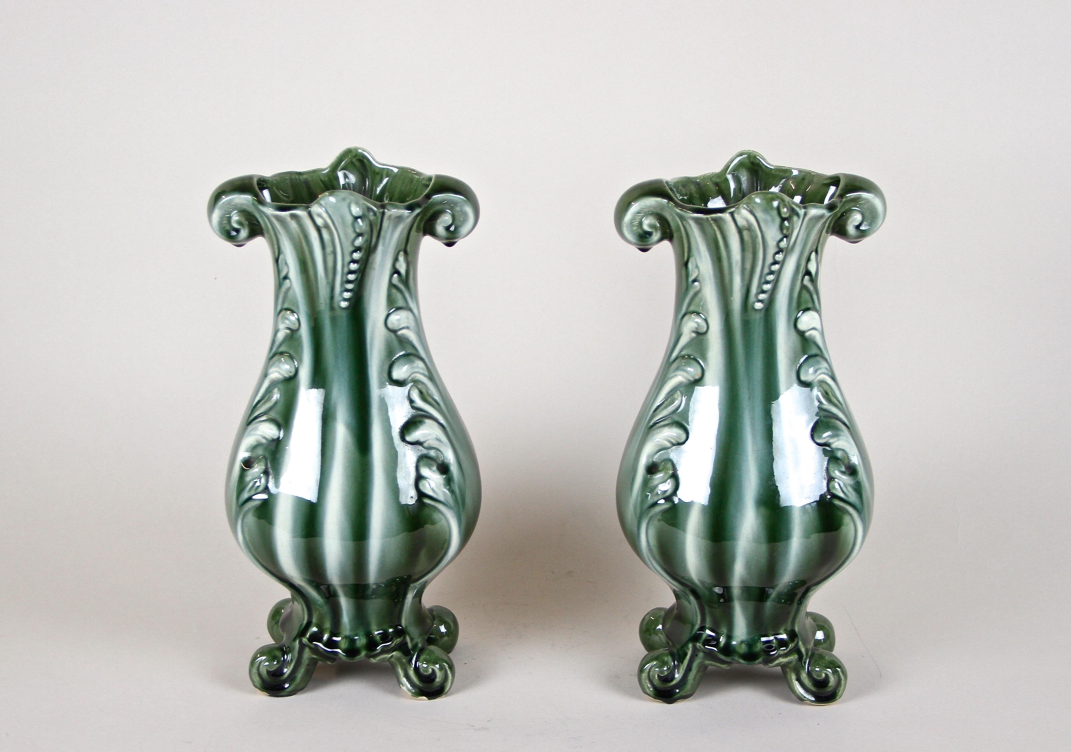 Lovely pair of Art Nouveau Ceramic Vases from the period in France around 1900. The unusual shaped vases show a beautiful glazed surface in very special green and white tones. A real nice pair of french ceramic vases from the early 20th century.