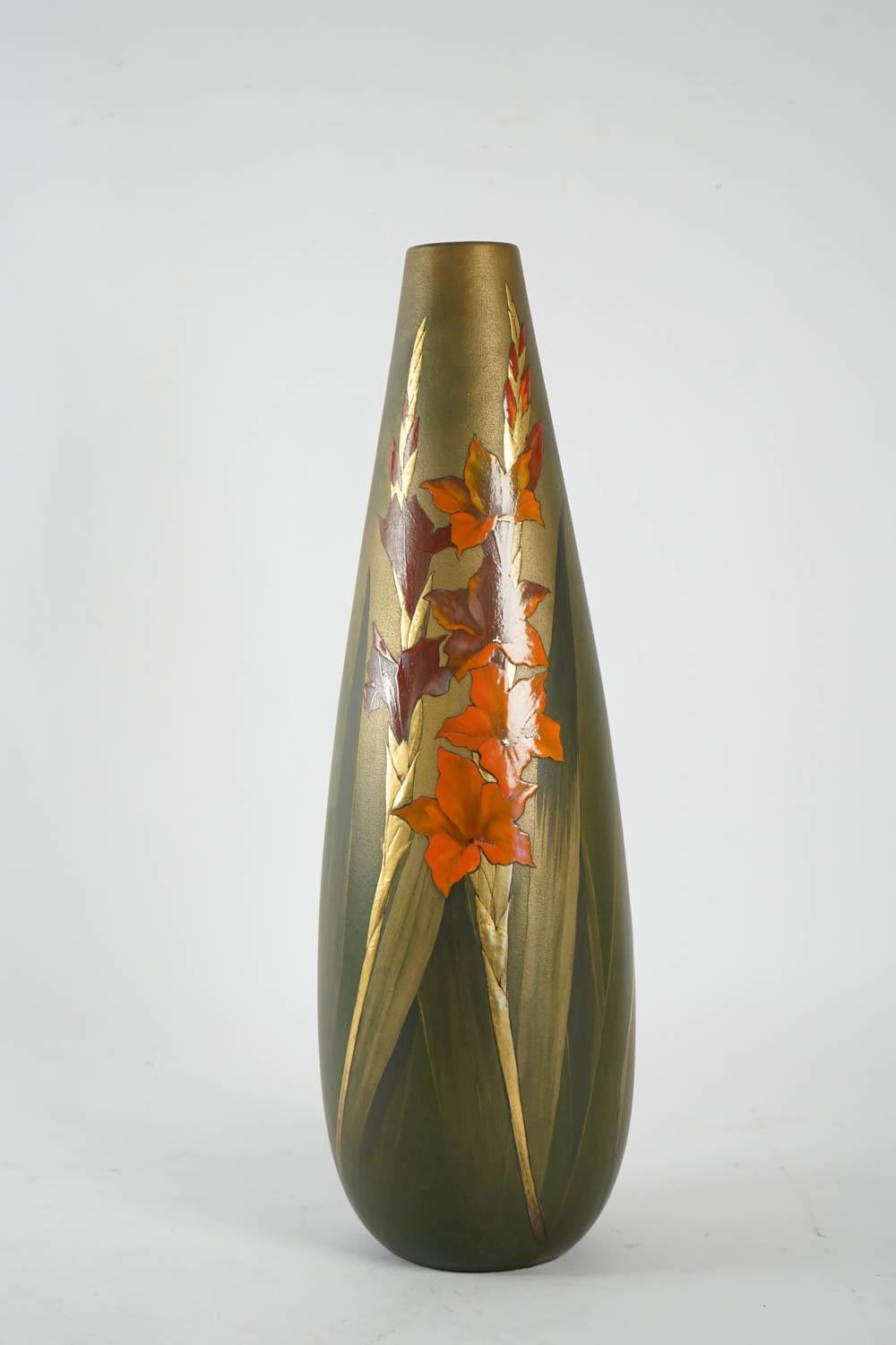 Pair of ceramics vases, Art Nouveau period, green enameled base, with decors of Iris branches d'iris orange, violet and gold, signed under the base Clément Massier Golfe Juan, AM.
Clément Massier is considered as the founder, at the beginning of