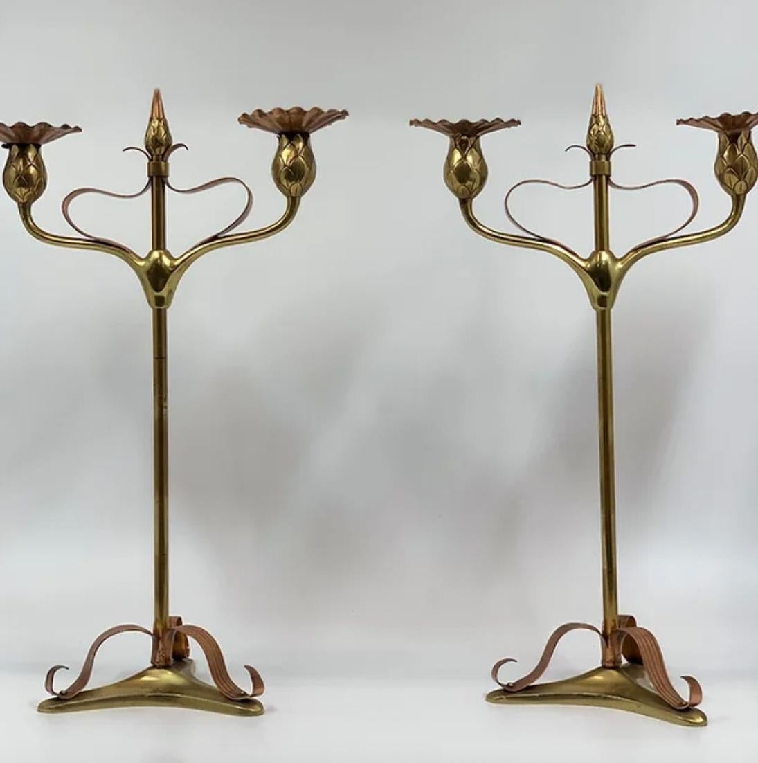 Pair of Art Nouveau (1890-1910) copper & brass candlesticks. 

Each has exceptional detail. 

Each holds two candles & the height can be adjusted. 

Measure: height approx. 51 cm.