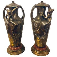 Pair of Art Nouveau Figural Urns Mounted as Lamps