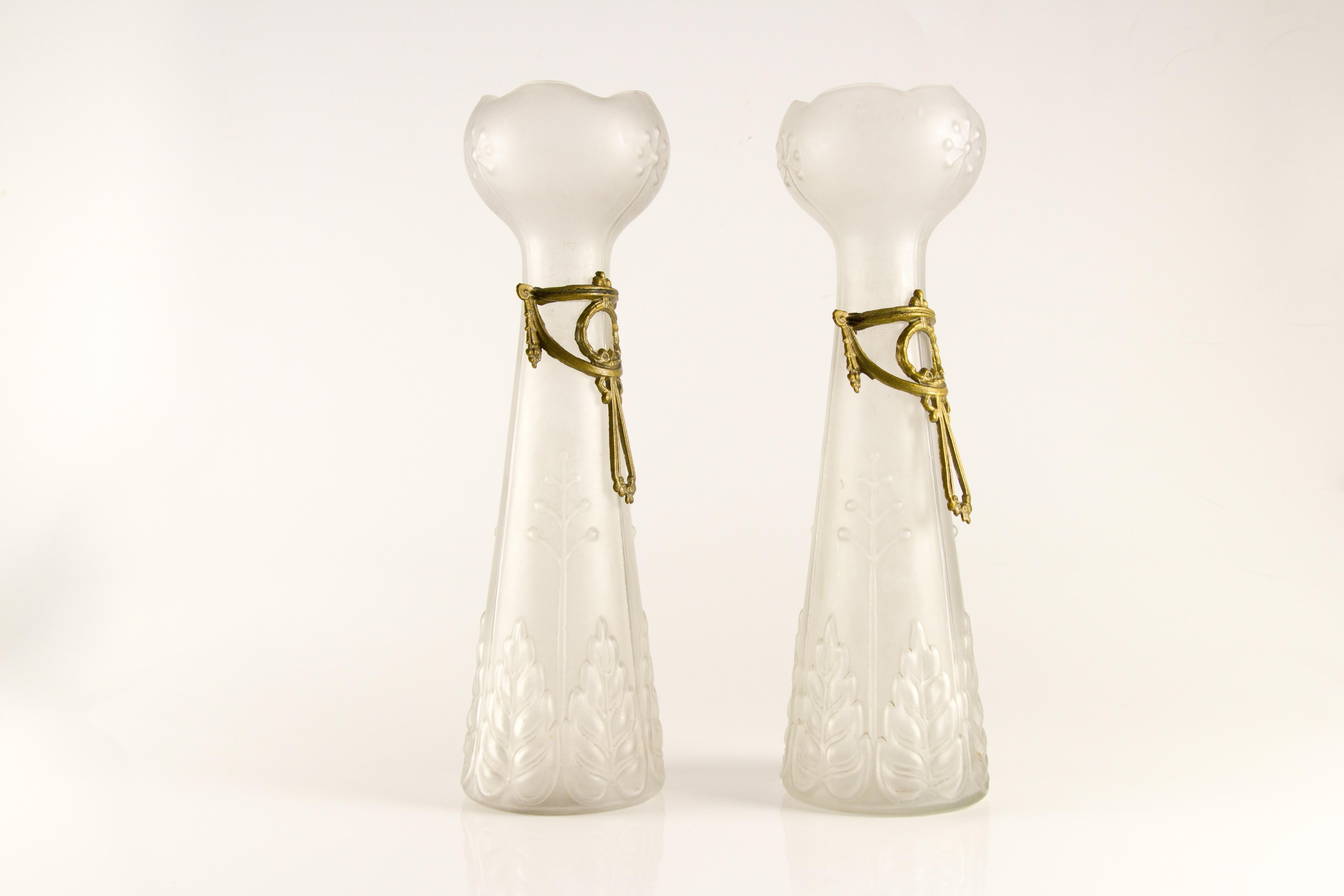 Pair of elegant French Art Nouveau frosted glass vases with brass decors.
Dimensions: height: 33 cm / 12.99 in; diameter of base: 9.5 cm / 3.74 in; diameter of top: 10 cm / 3.93 in.
 