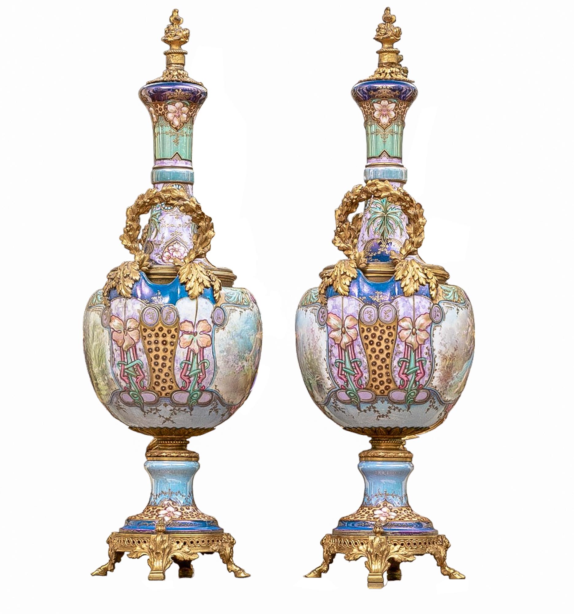  An antique pair of Sevres style, Art Nouveau inspired, ormulu mounted, hand painted porcelain urns, signed 