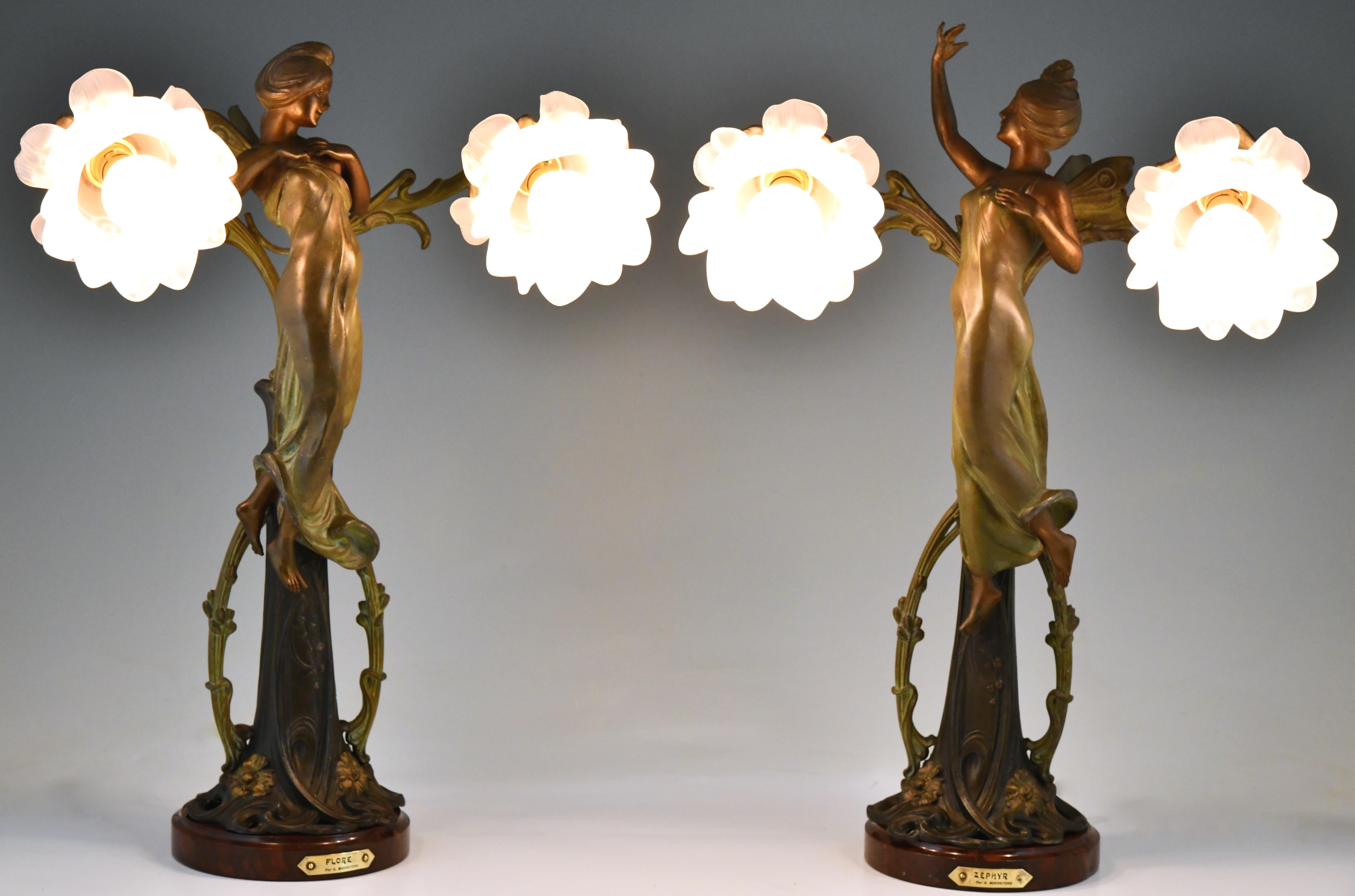 Pair of Art Nouveau lamps ladies and flowers, Zephyr & Flore signed by Claude Bonnefond.
Patinated metal, glass and Belgian red marble.
France circa 1900.
Information of the artist:
Etains 1900, Philippe Dahhan, les editions de l'amateur.