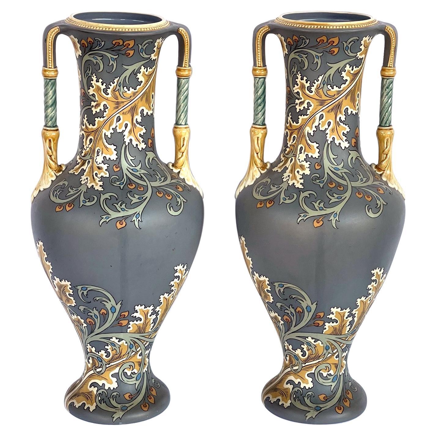 Pair of art nouveau Mettlach pottery vases with incised markings to underside