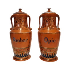 Pair of Art Nouveau orange apothecary jars, hand-painted porcelain