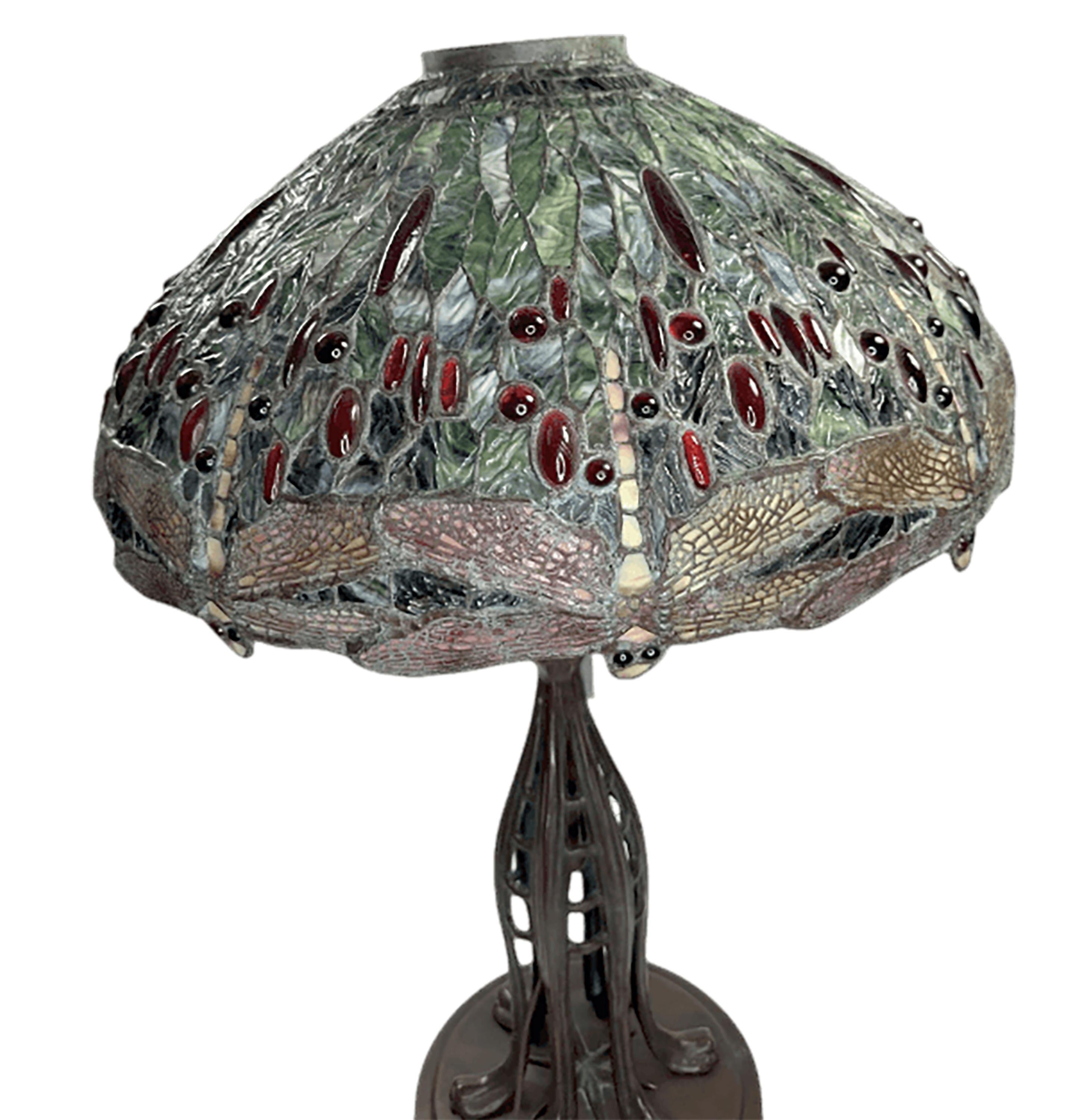 A pair of extraordinary art nouveau Tiffany style lamps with hand-made leaded glass shades. Each lamp shade has a unique finely detailed leaded glass design. The body is made of bronze with a rich chocolate brown patina. It is supported by six