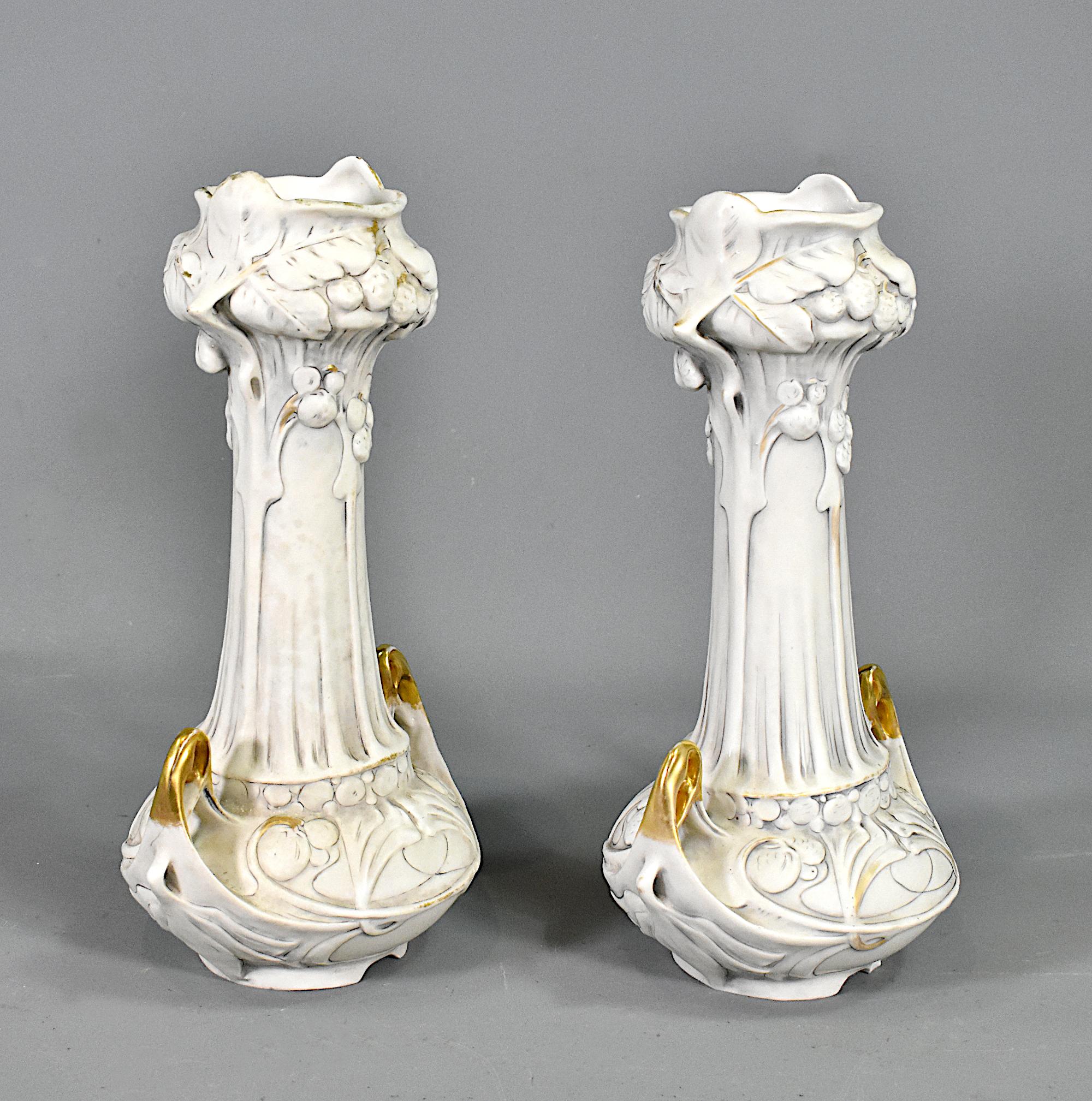 Pair of Art Nouveau Vases by Royal Dux Bohemia 

A lovely pair of Art Nouveau vases by Royal Dux Bohemia in biscuit porcelain with relief and partial gilding. 

The vases feature delicate woodland berries and floral decoration in classic Art Nouveau
