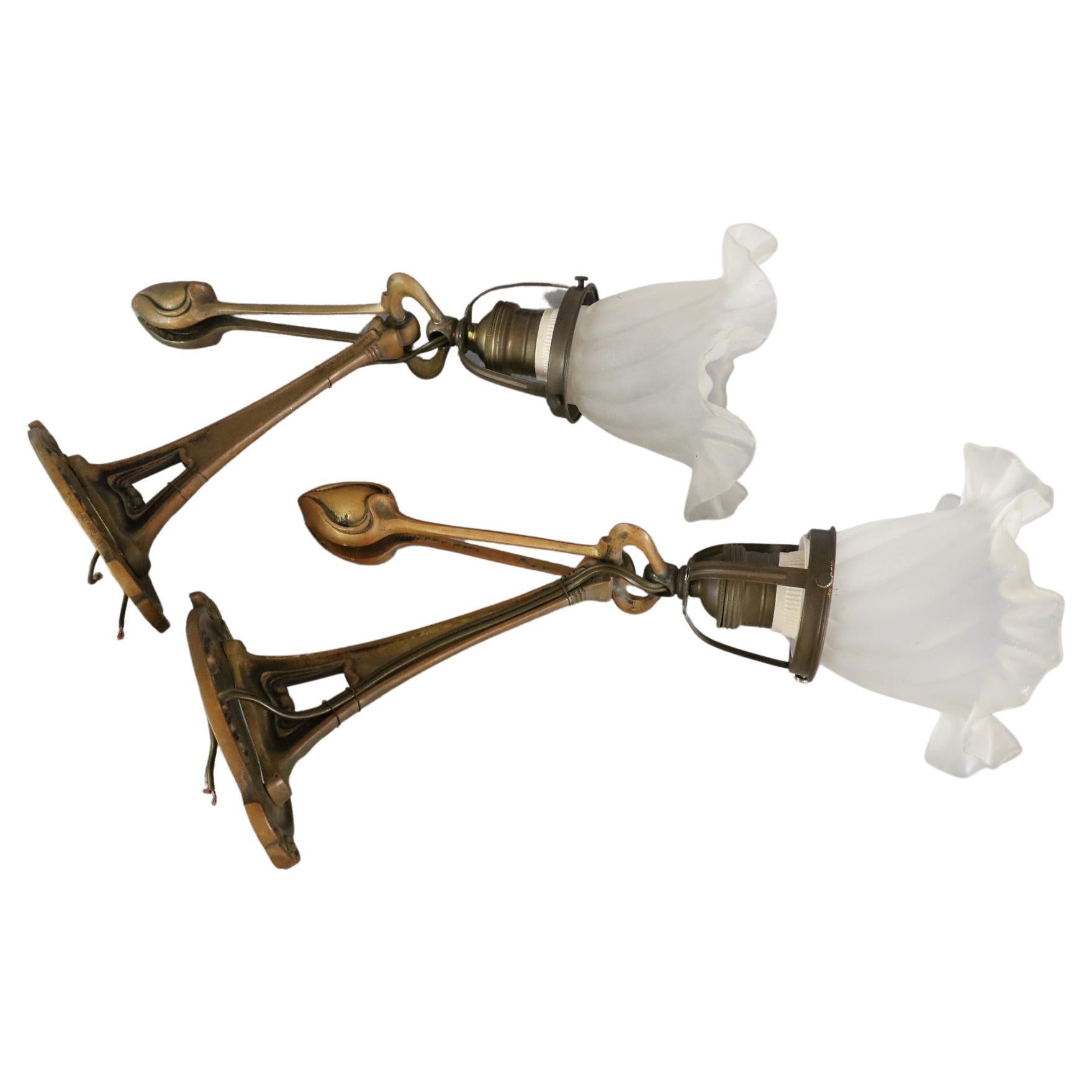 Pair of Art Nouveau Wall Lamps in the style of Hector Guimard France

Beautiful pair of wall sconces in bronze and opaline of Art Nouveau style. They are characteristic of the style of the time. We recognize the patterns, the delicate and rounded