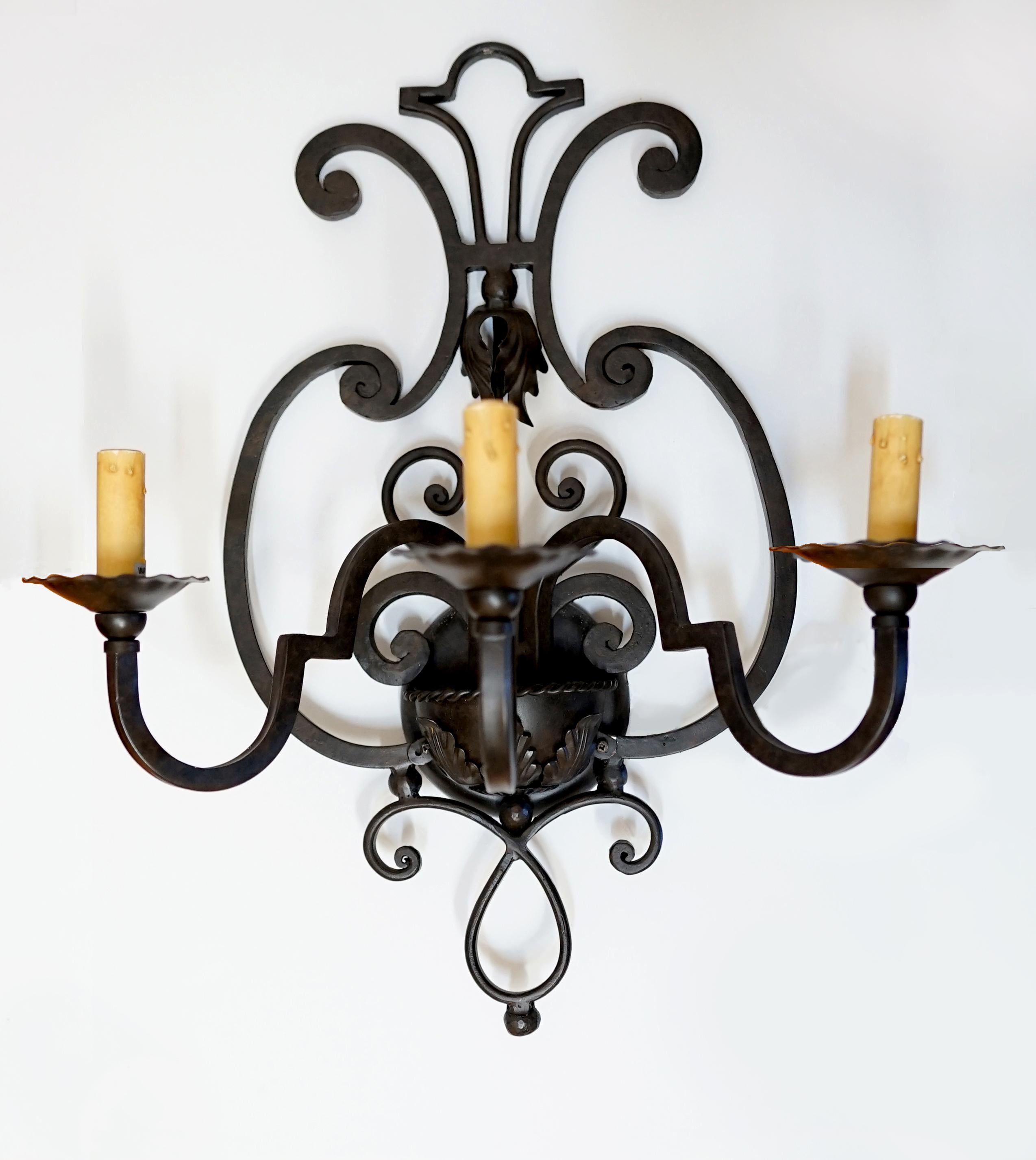 Arte de Mexico, the Southern California lighting creator for 40 years presents this fabulous pair of old Spanish style sconces. The hand crafted sconces are completed by Mica shades which create a warm light. Arte de Mexico utilizes old world hand